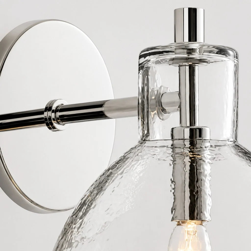 Close-up of the polished nickel arm and hammered glass dome