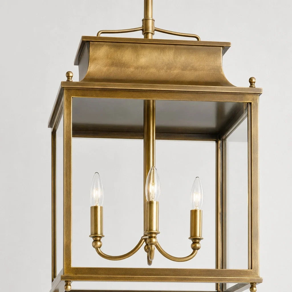 Close-up of the vintage brass lantern frame and candelabra arms