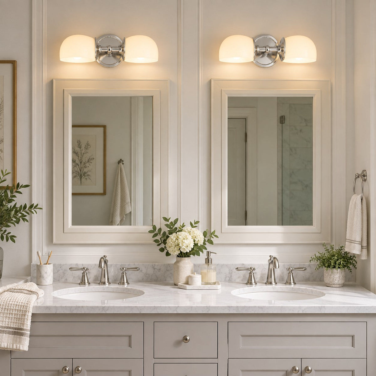 Pair of nickel double milk glass sconces over a double bathroom vanity