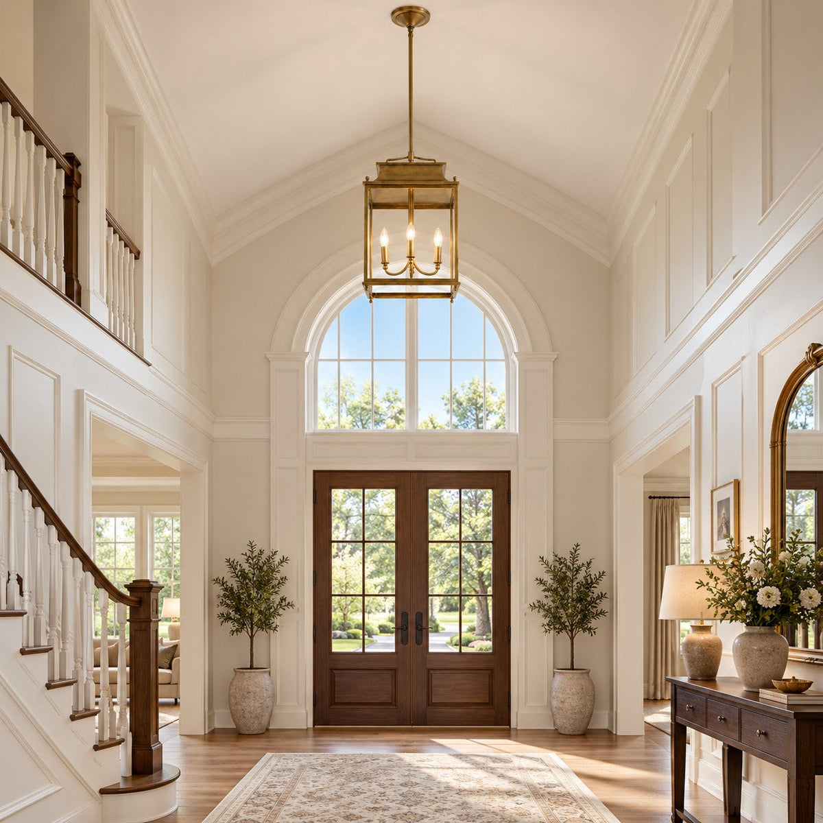 Brass glass lantern pendant in a double-height foyer above an arched front door