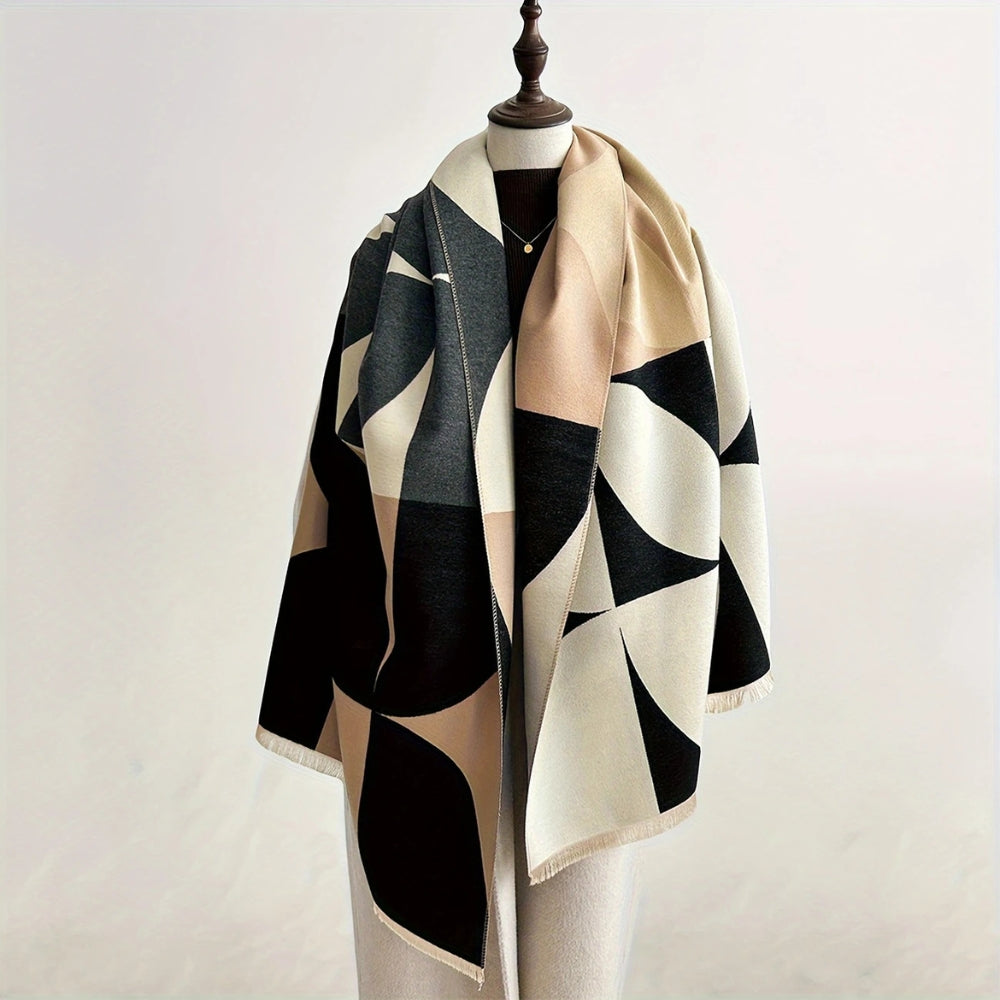 Woman wearing Tigershade Charcoal reversible geometric wrap poncho