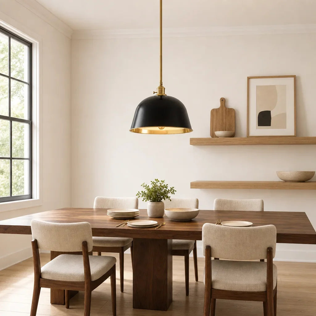 Black bell pendant above a walnut dining table beside open shelves