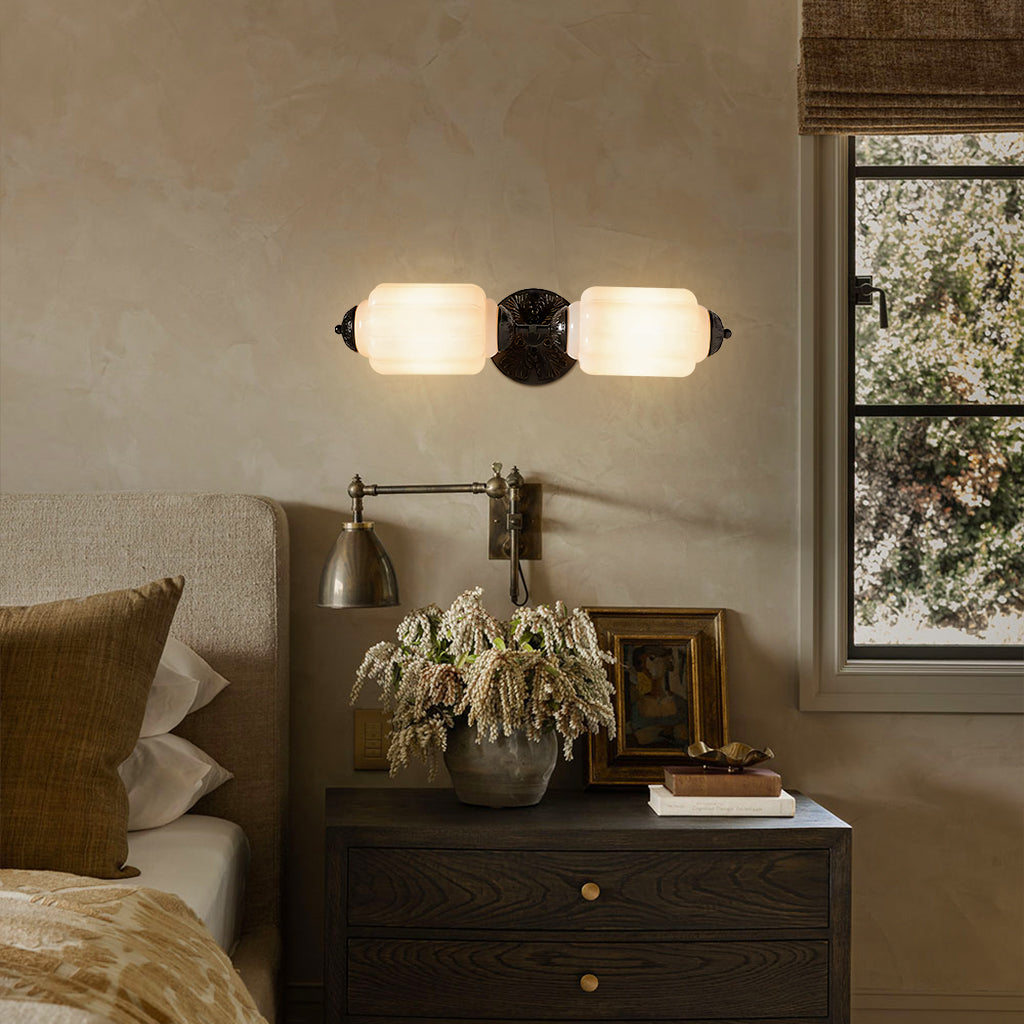 Raggiera Deco wall light with white glass and black plate above a bedside table