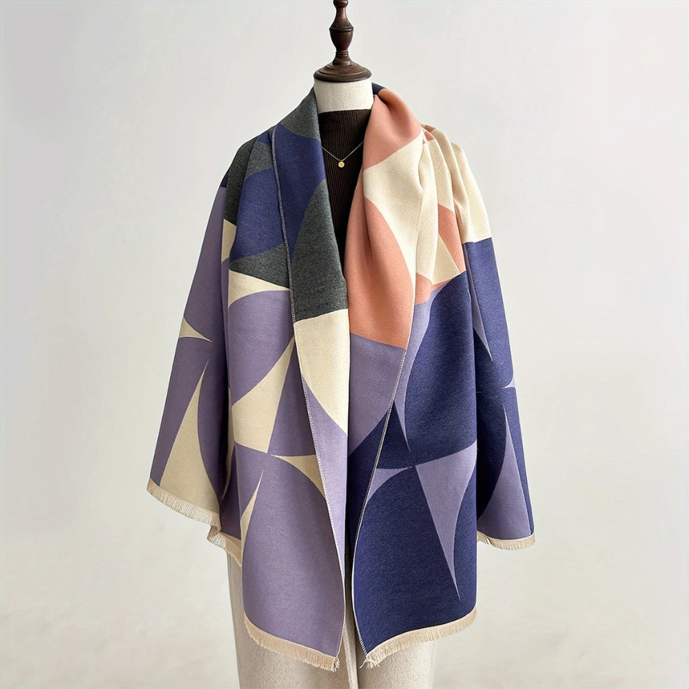 Woman wearing Dawnstone Indigo reversible geometric wrap poncho