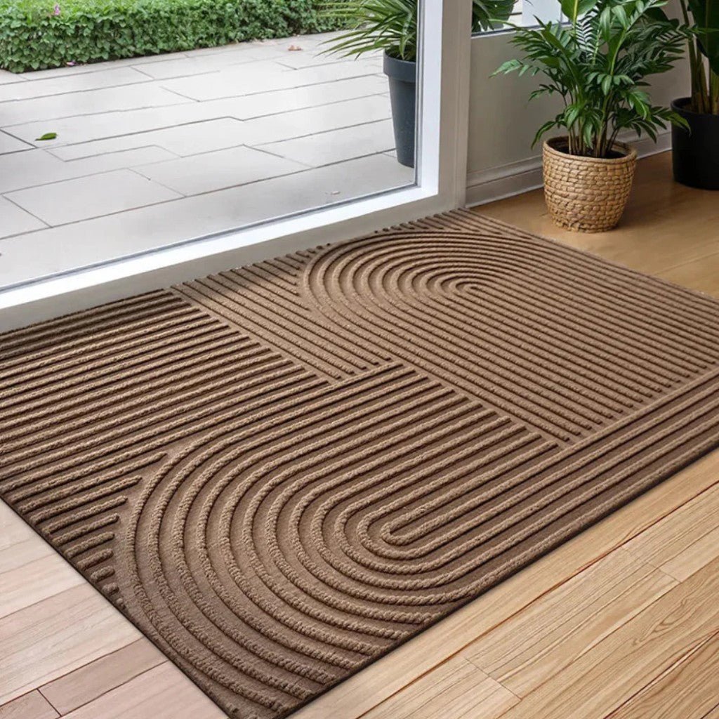 https://cdn.shopify.com/s/files/1/0655/0464/1076/files/3d-grooved-geometric-doormat-anti-slip-scraper-entrance-mat-6563226.jpg?v=1779807074
