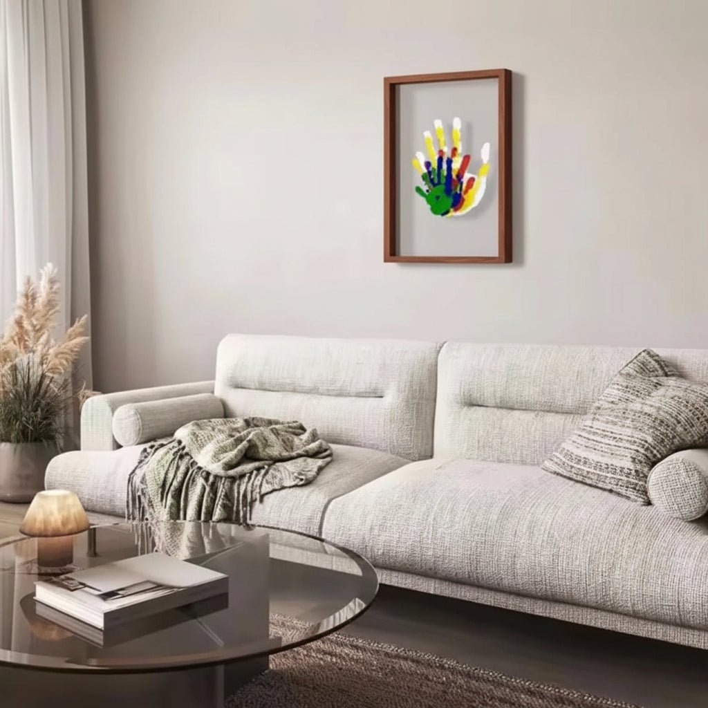 Brown keepsake frame on a living room wall above a sofa