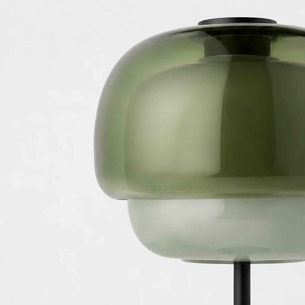 Close-up of the gray green translucent glass dome over the milky lower shade