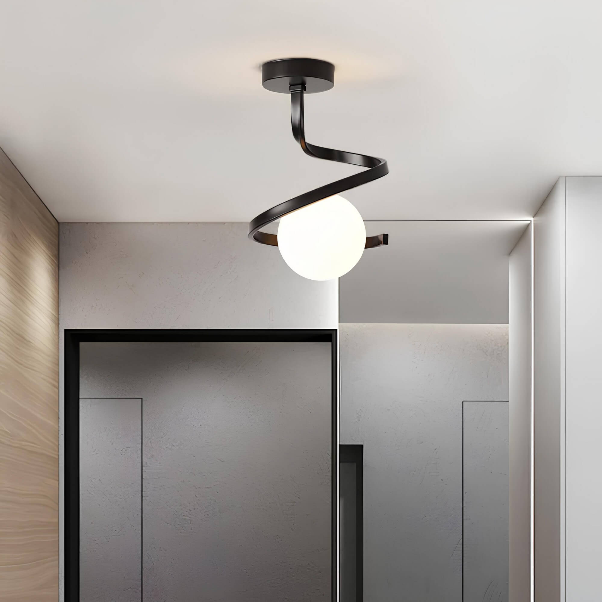 Spirale Lunare black spiral ceiling lamp mounted in a modern entryway