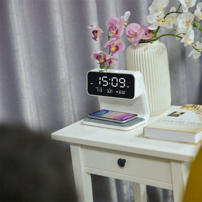 Aurora bedside station with orchids on a white nightstand, LCD clock showing the time