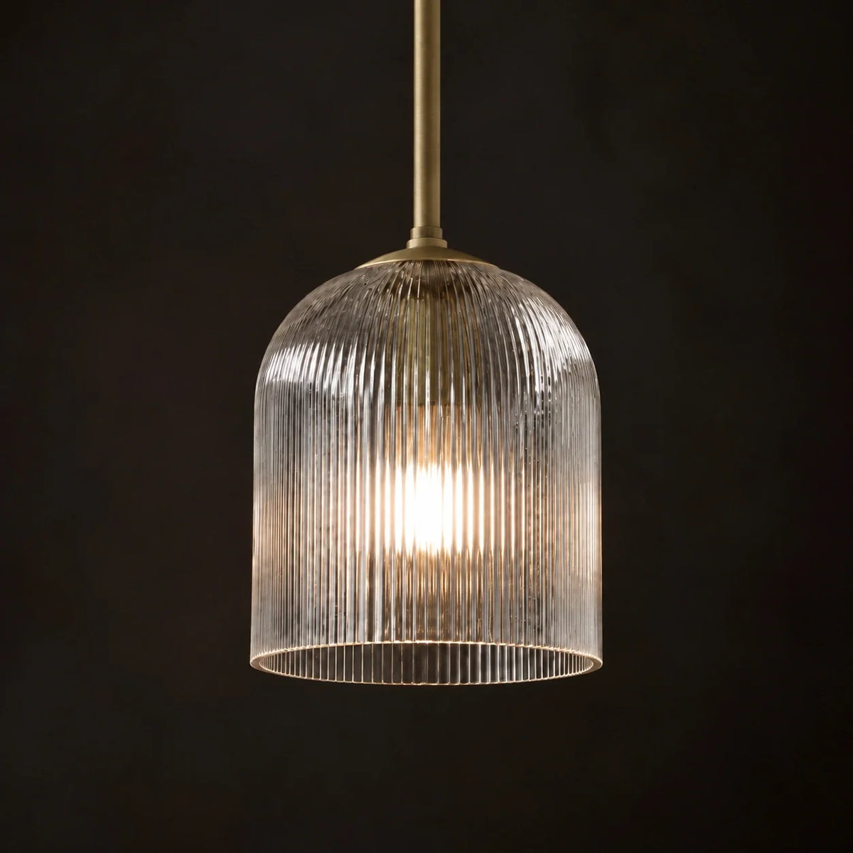 Ribbed glass dome detail of the Vetro Scanalato pendant, lit