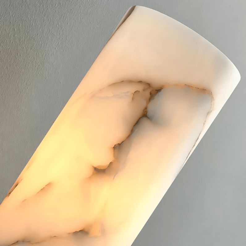 Close-up of the glowing translucent marble shade of the Aurora Wall Sconce