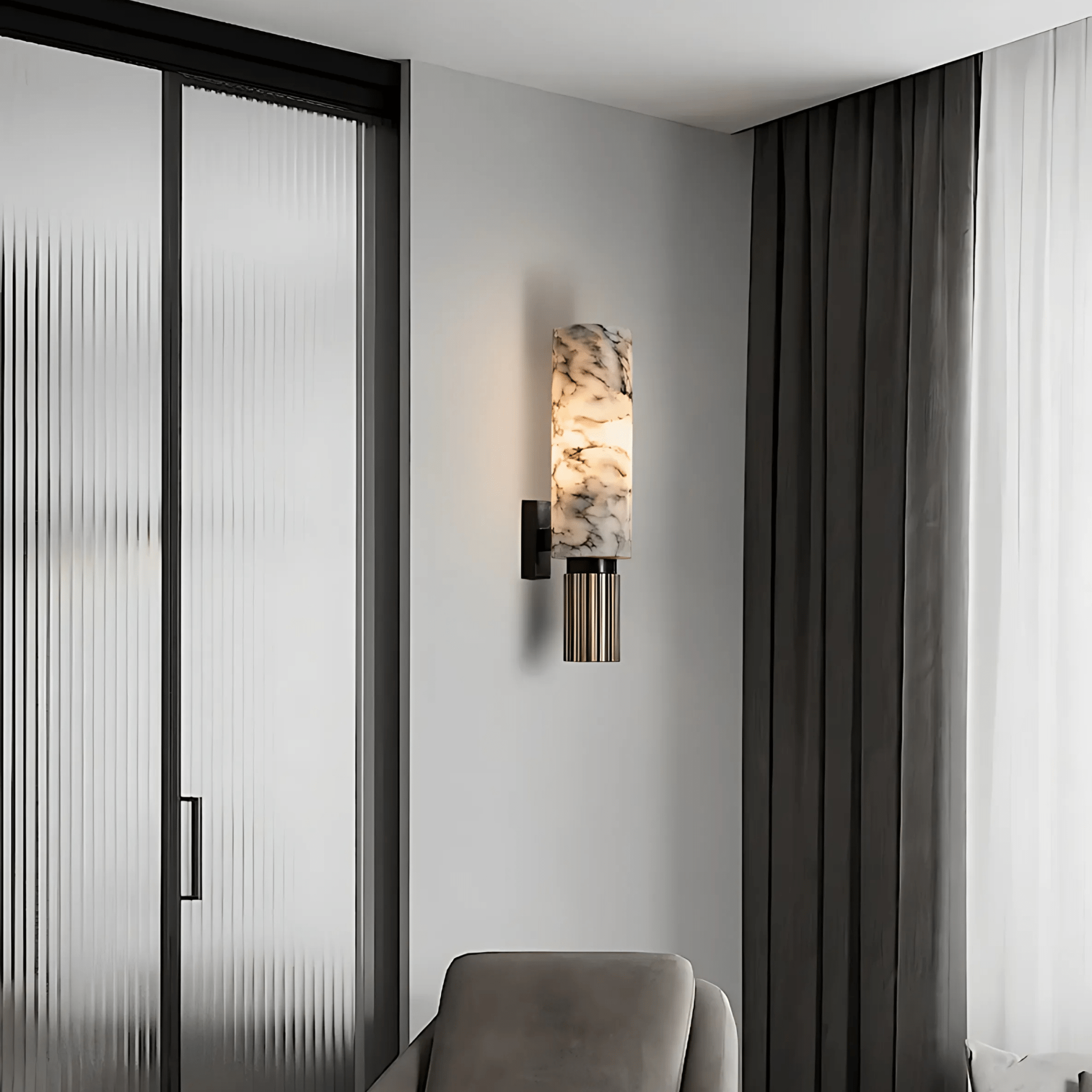 Aurora Marble Wall Sconce beside a reeded-glass door and armchair