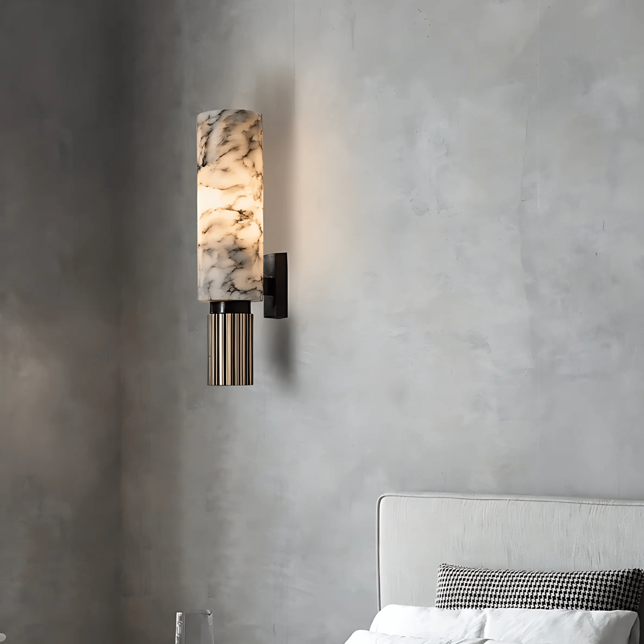 Aurora Marble Wall Sconce glowing on a soft grey bedroom wall