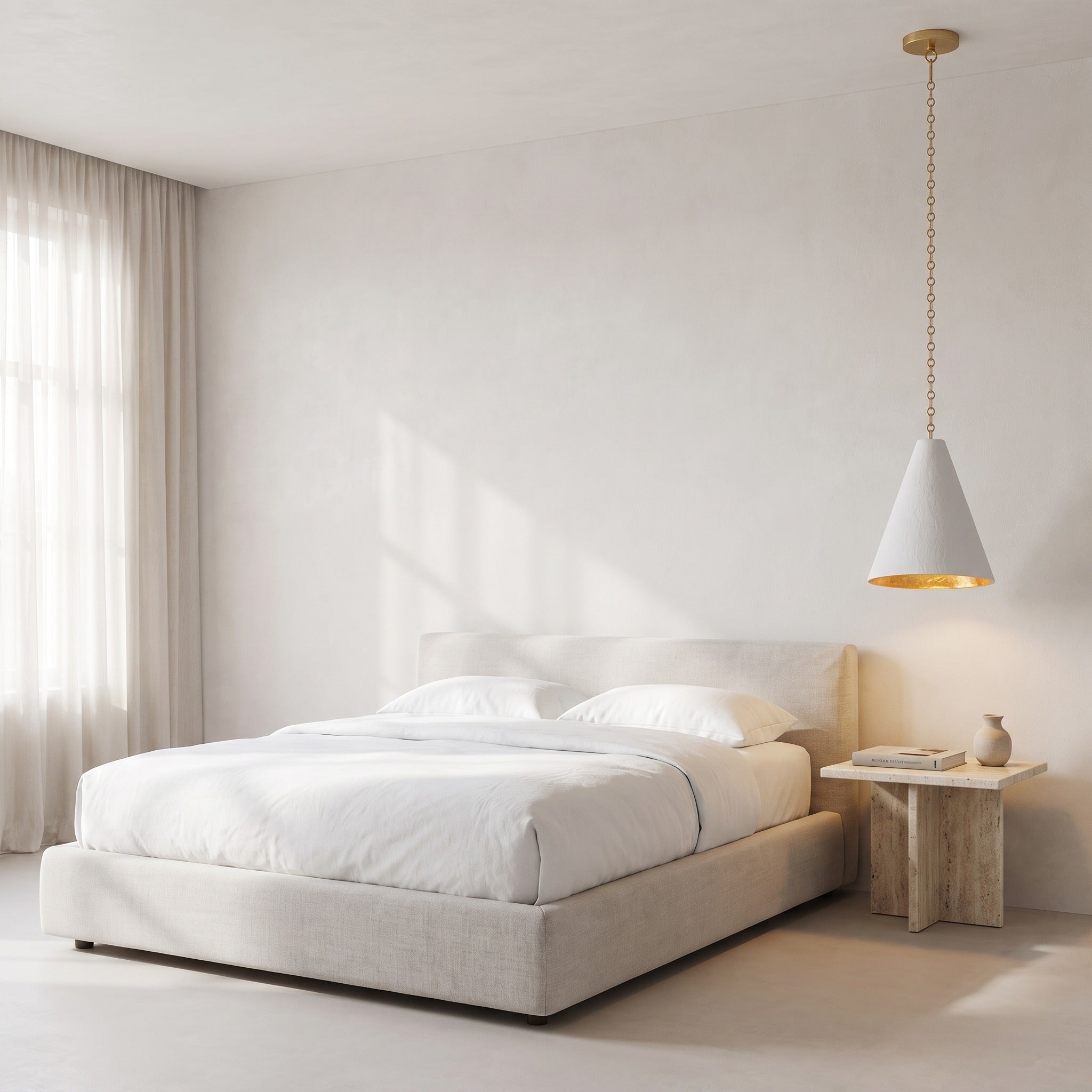 Calma Gessata plaster pendant hanging over a travertine nightstand in a serene bedroom