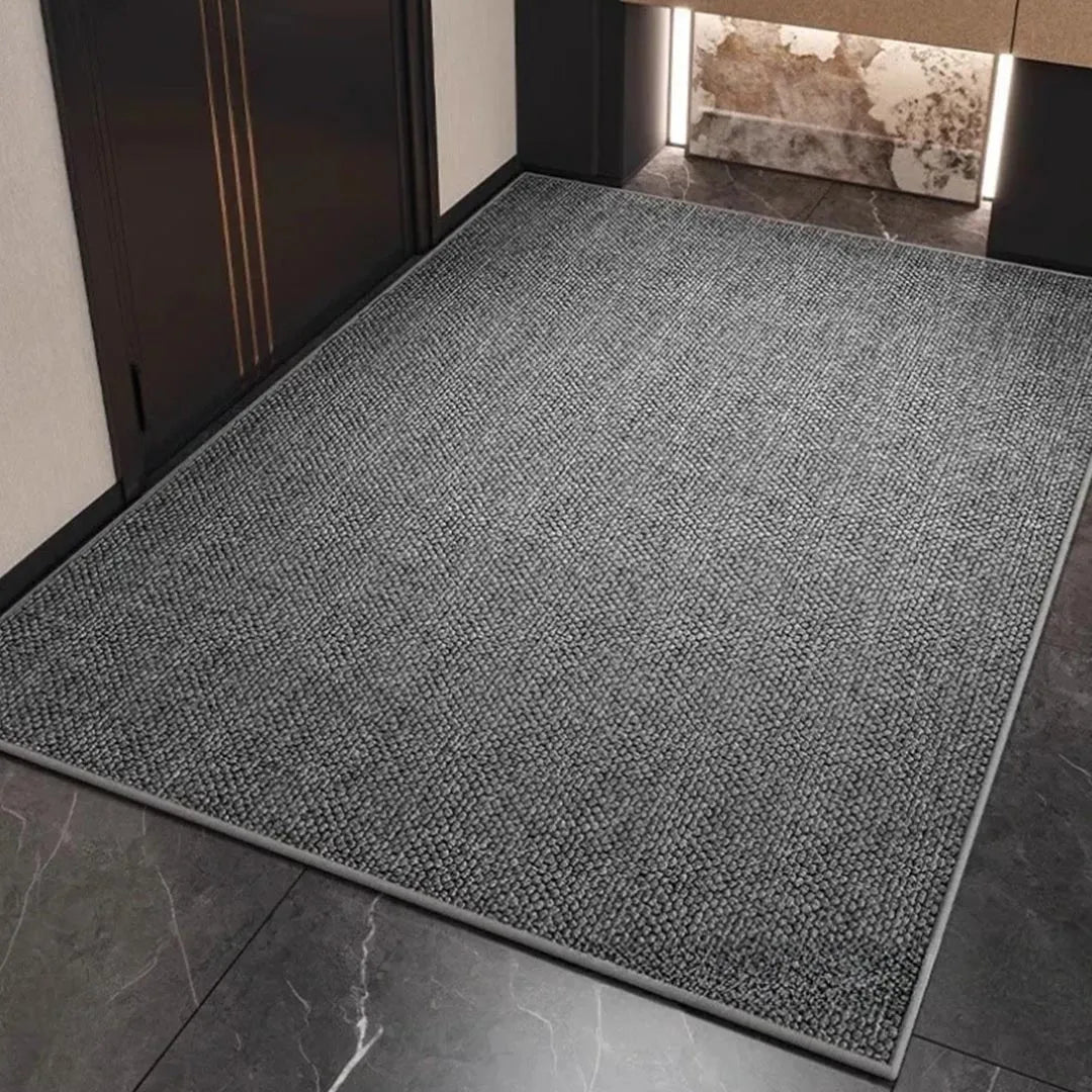 Gray woven mat in an elegant entryway on marble