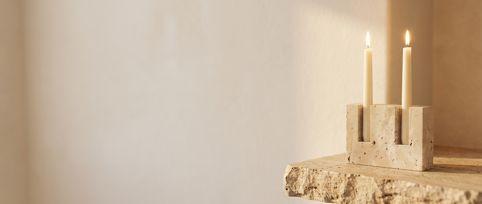 Bagliore Sereno travertine candle stand lifestyle banner