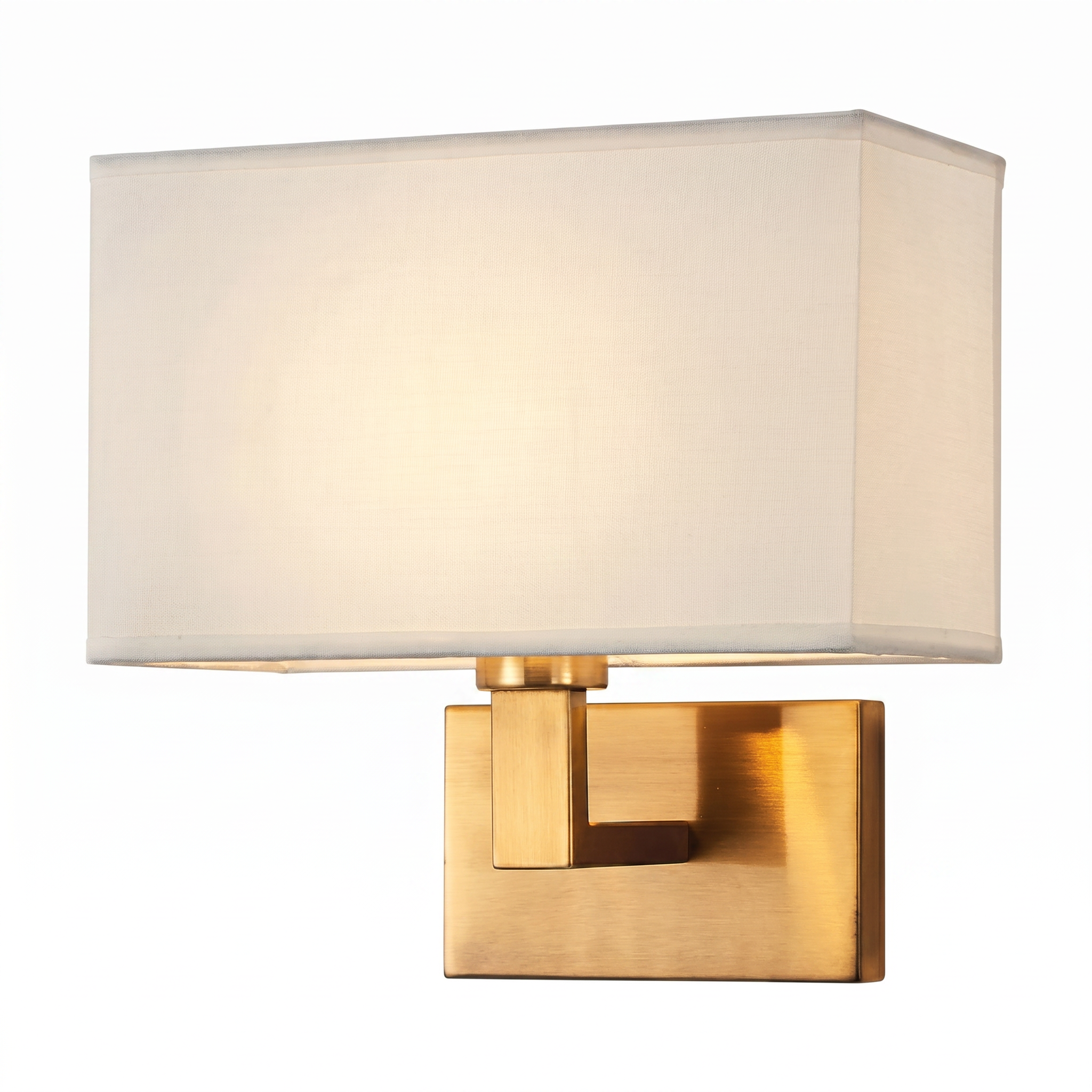 Cuboid fabric wall sconce, gold arm with white shade glowing warm, clean studio product shot