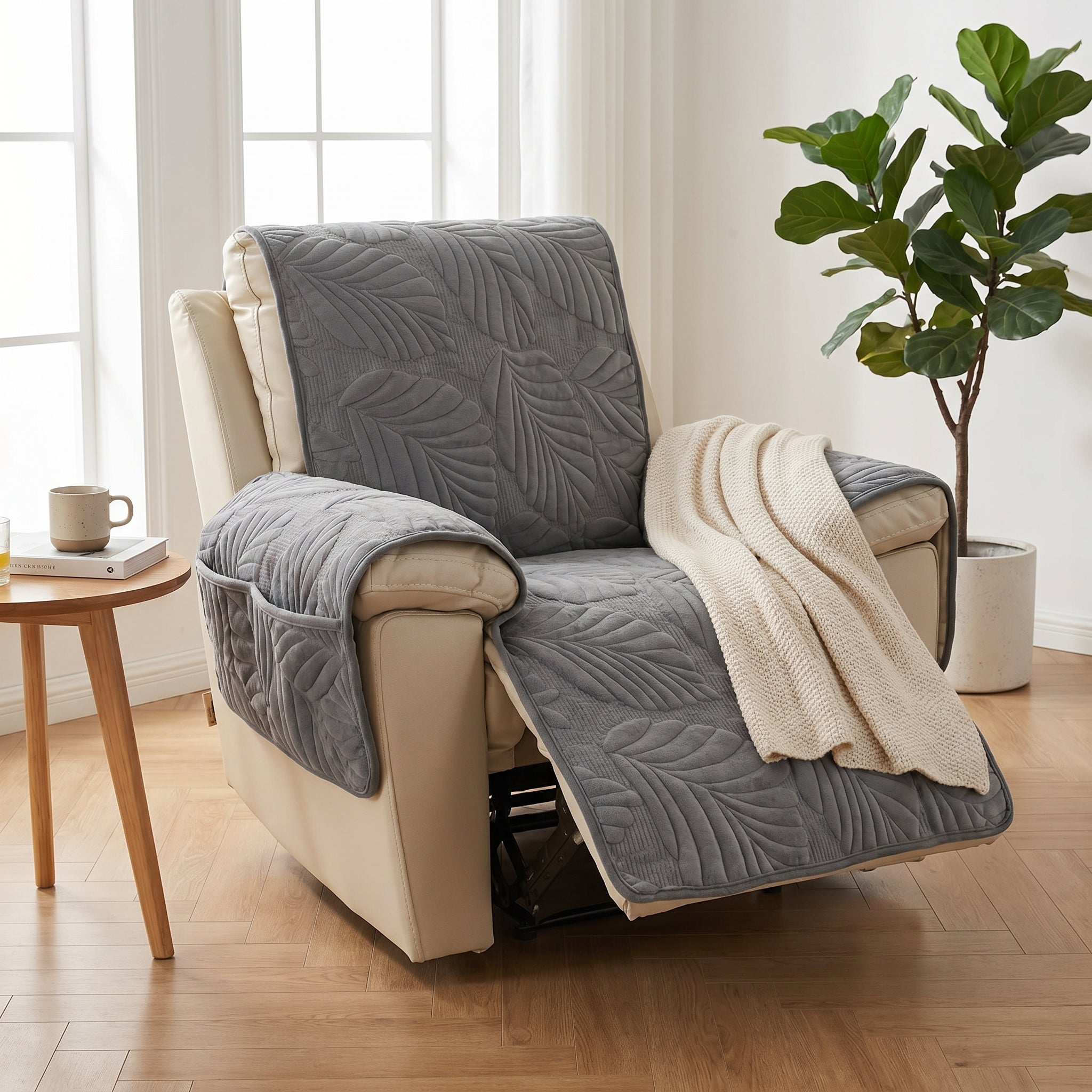 Dark grey quilted leaf-pattern recliner slipcover fitted on a recliner in a calm modern living room