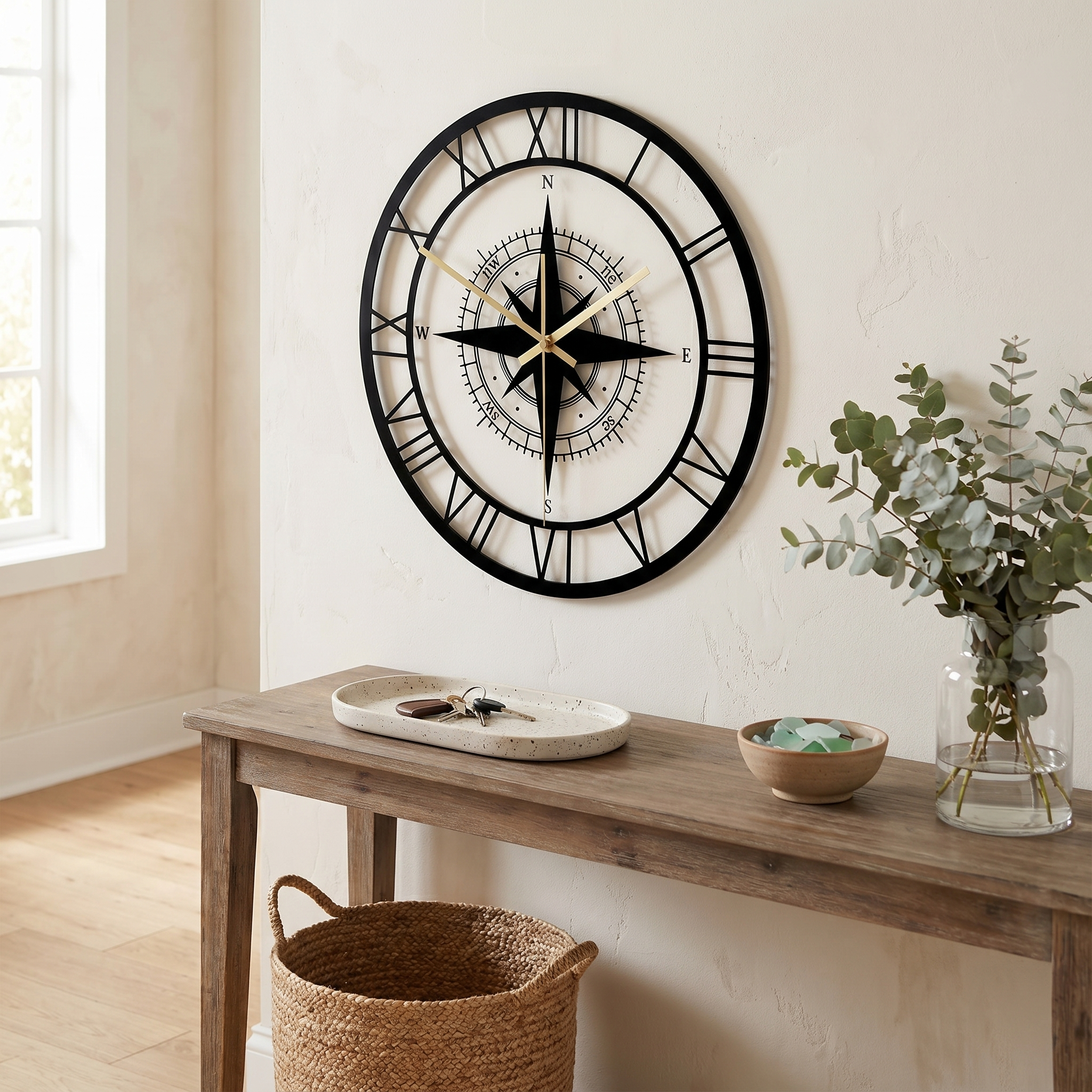Nautical compass wall clock above an entryway console with eucalyptus