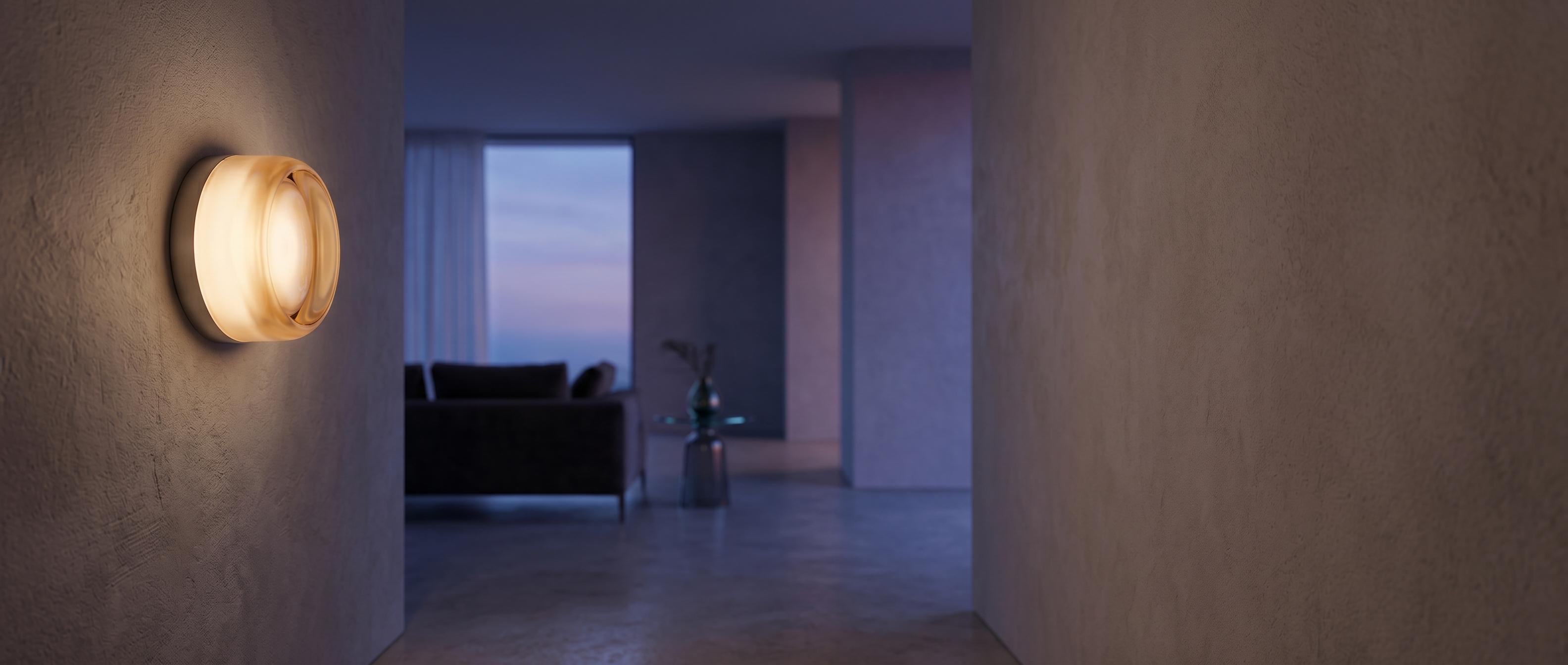 Luce Velata frosted glass wall sconce glowing in an elegant modern interior