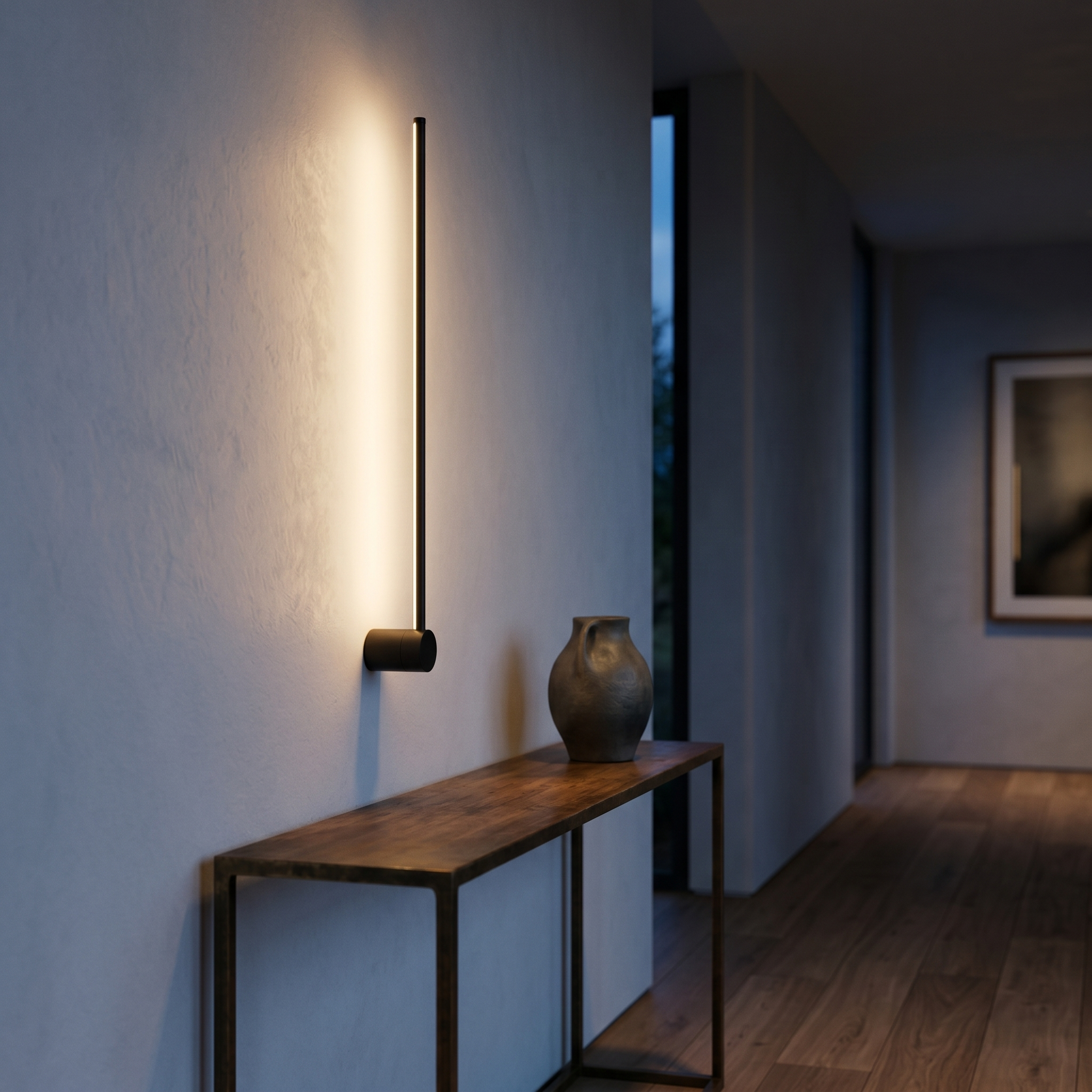 Filo di Luce black linear sconce in an elegant hallway at dusk