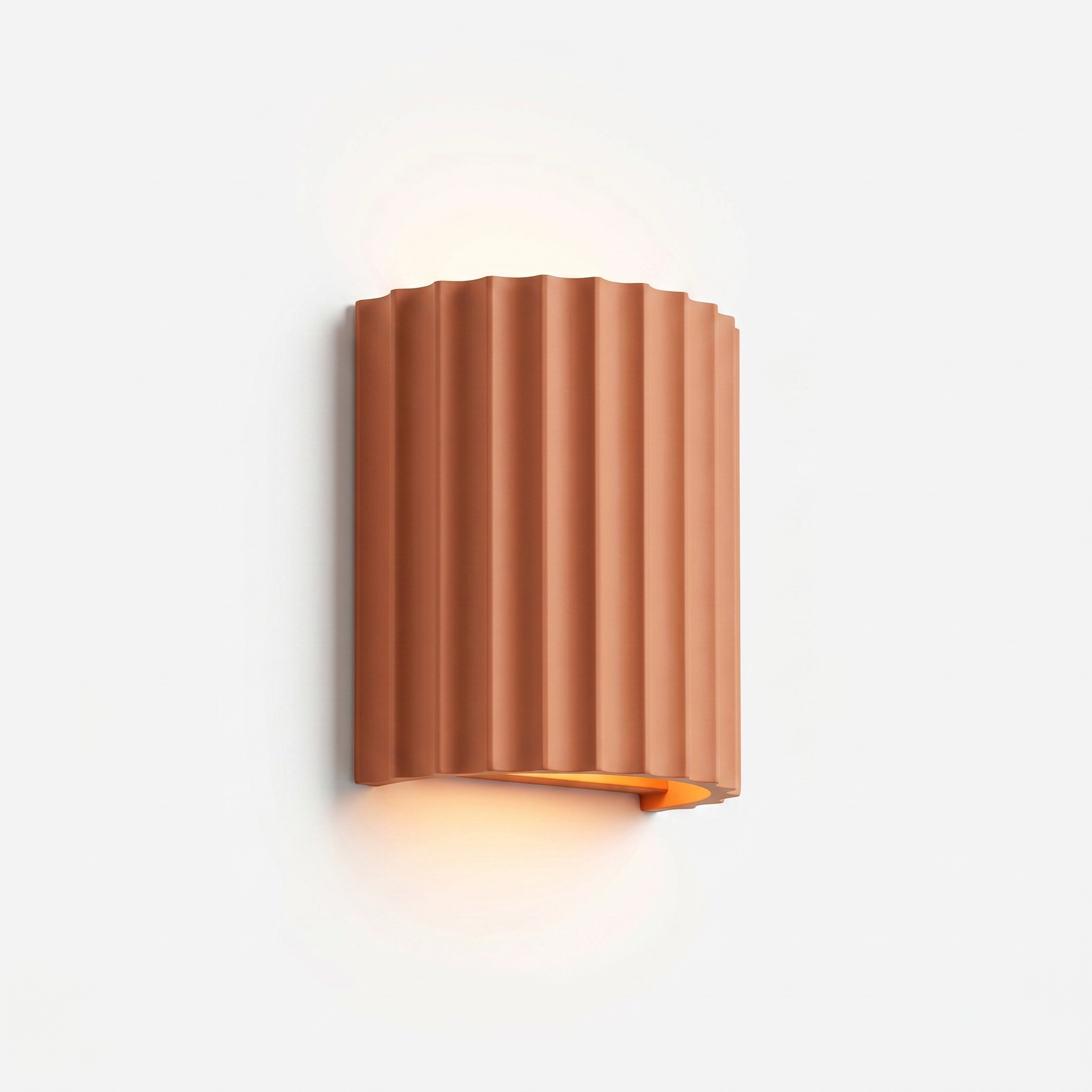 Conchiglia pleated resin wall lamp in terracotta orange, studio hero