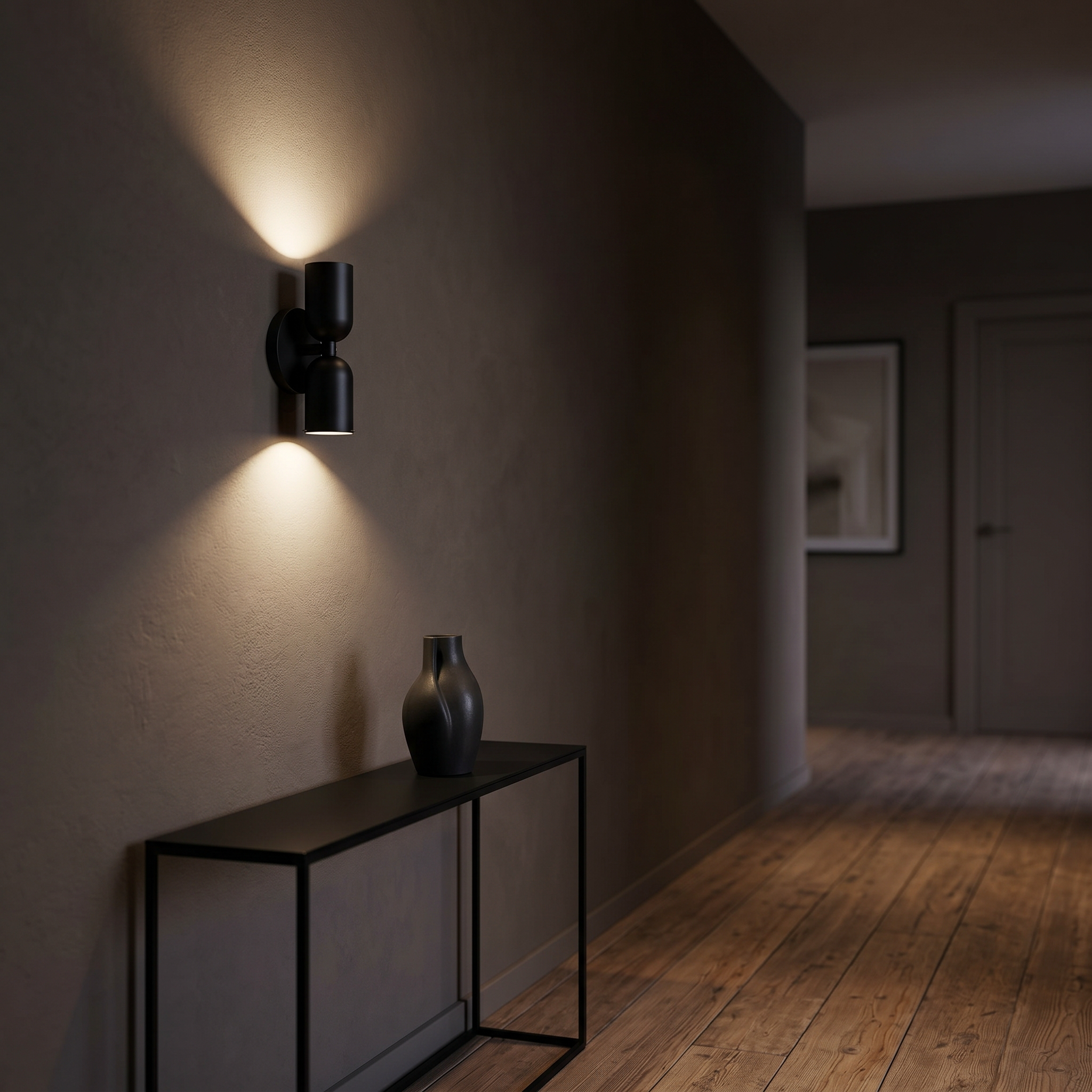Duetto All Black double-head lamp with dramatic up-and-down beams in a hallway