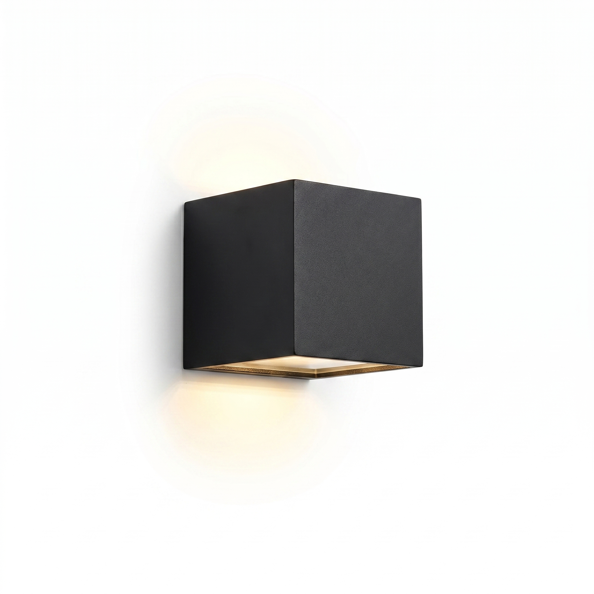 Cubo Luminoso black cube up-down wall light with warm glow on a white background