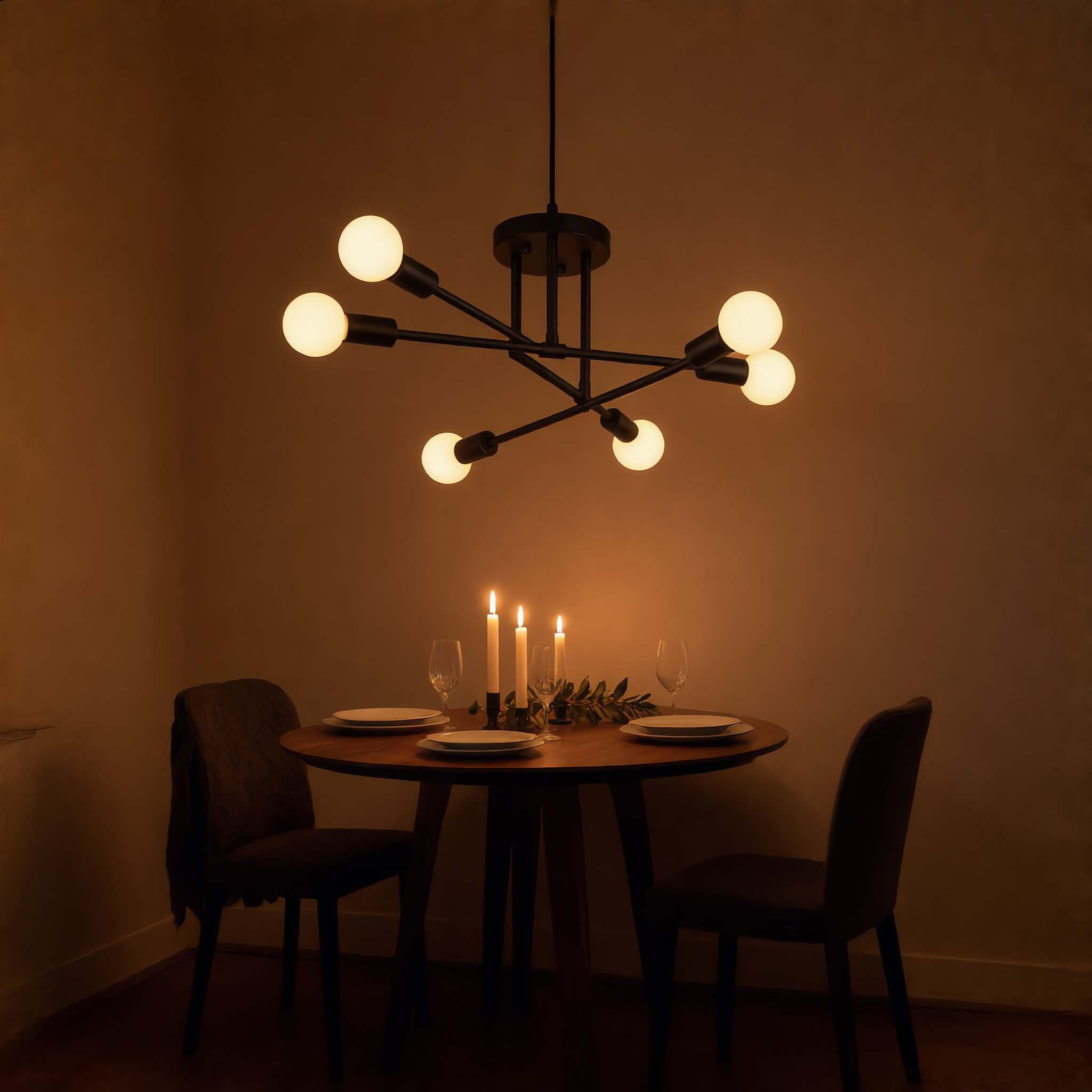 Black Sputnik ceiling light glowing above a candlelit round dining table set for dinner