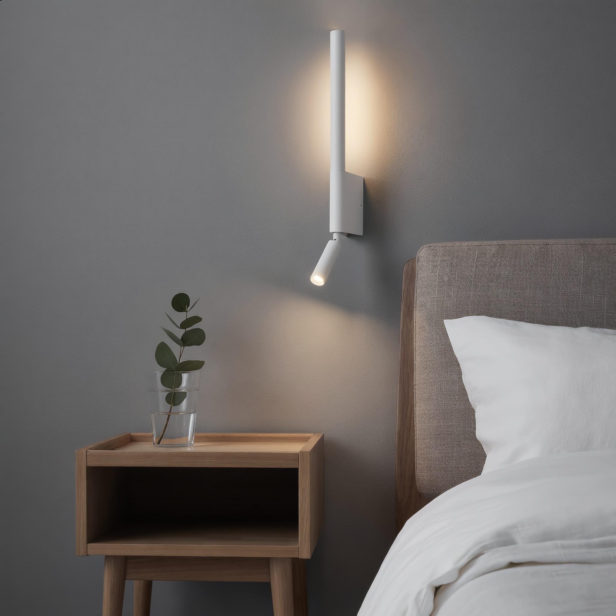White Carezza Notturna reading wall light in a serene Scandinavian bedroom