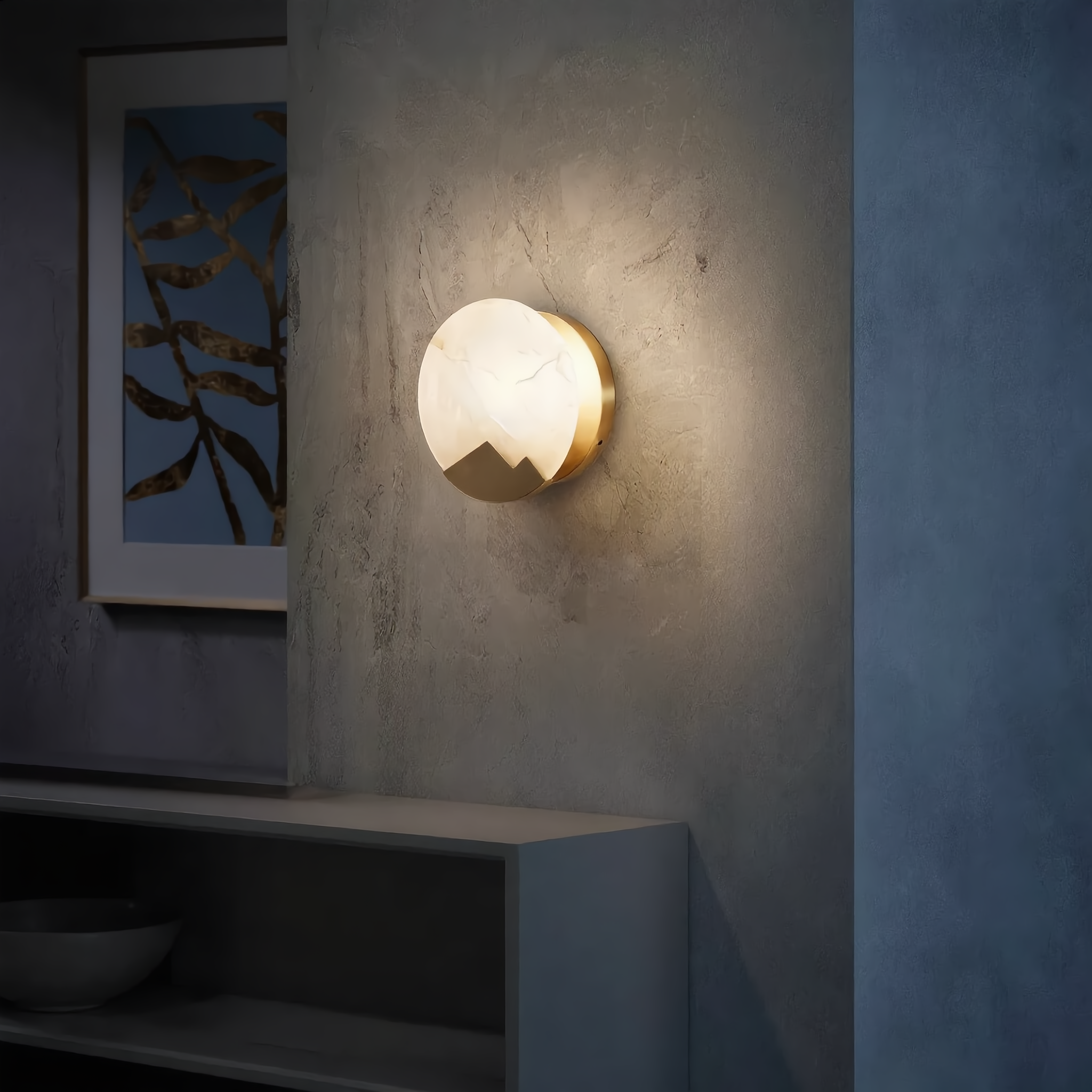 Luna d'Alabastro alabaster wall sconce in a minimalist entryway above a console