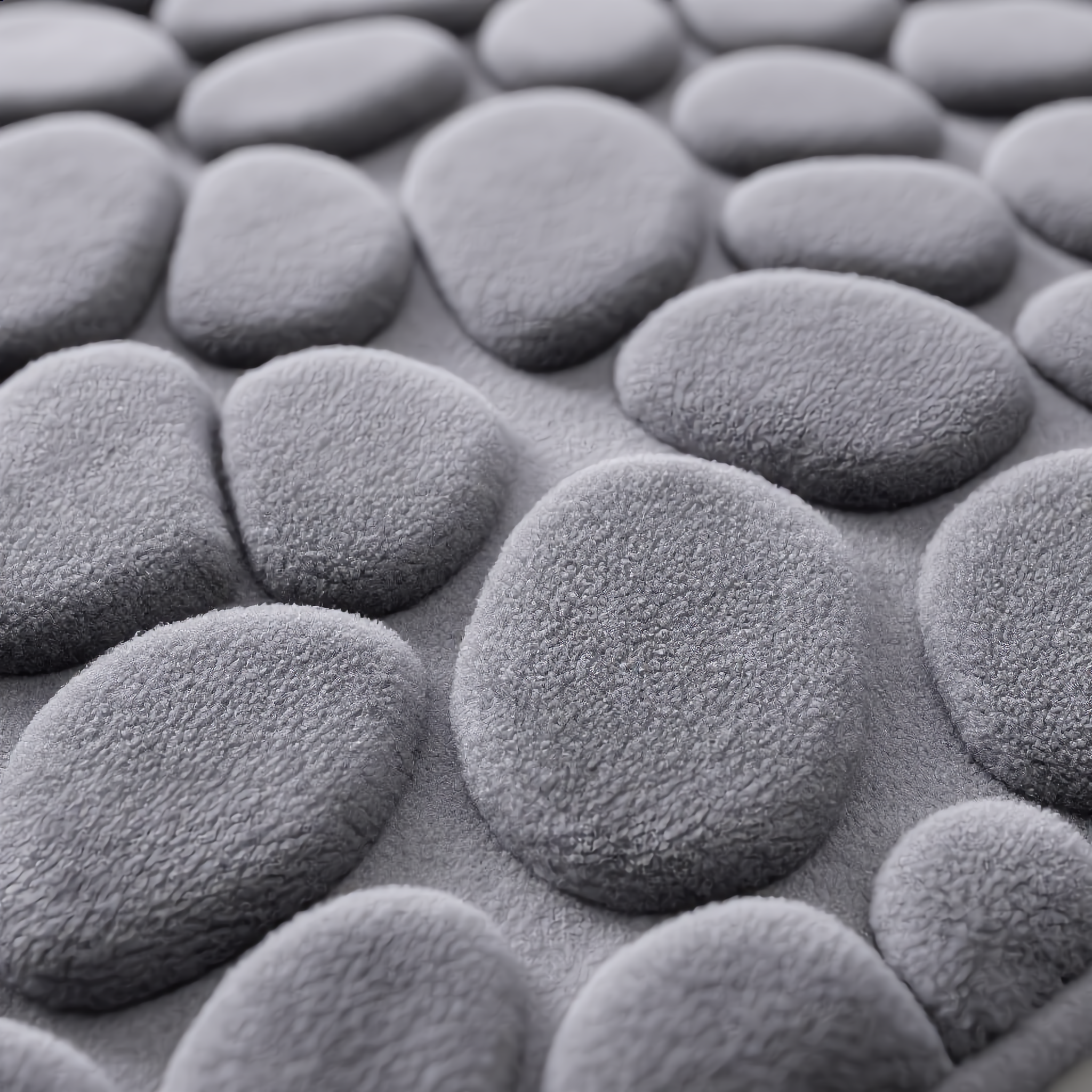 Macro close-up of the plush 3D cobblestone memory-foam texture