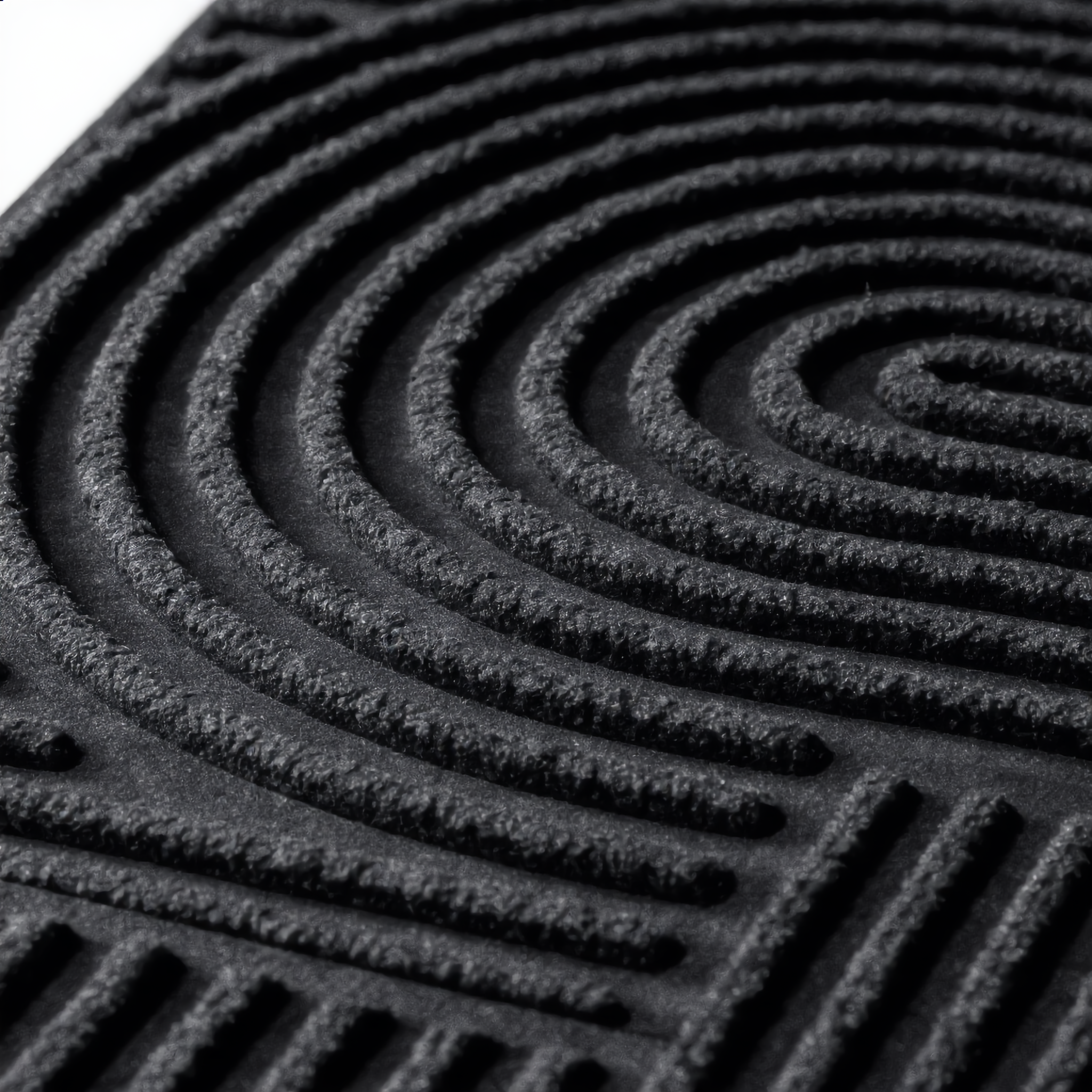 Macro close-up of the deep 3D scraper grooves