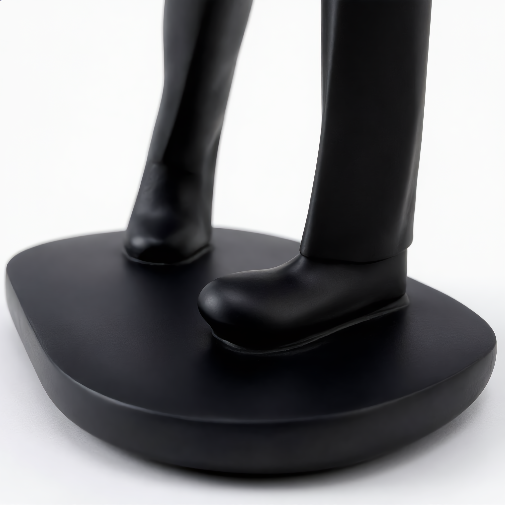 Close-up of the black oval base and matte resin finish