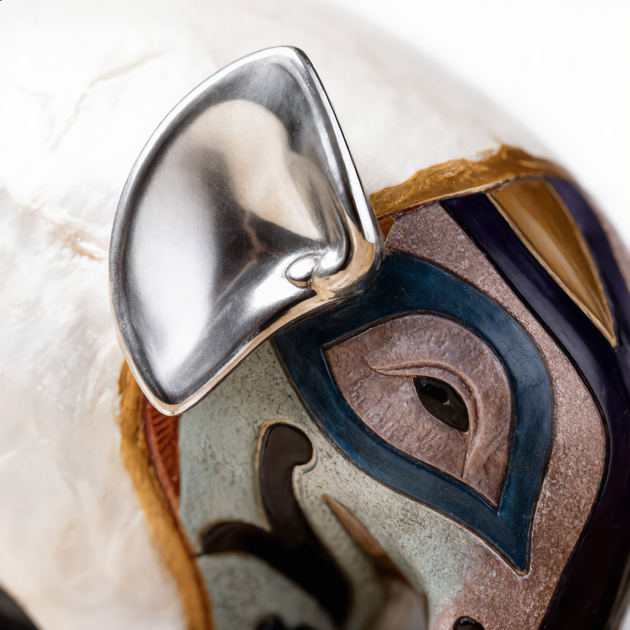 Close-up of the silver-leaf ear and painted eye detail
