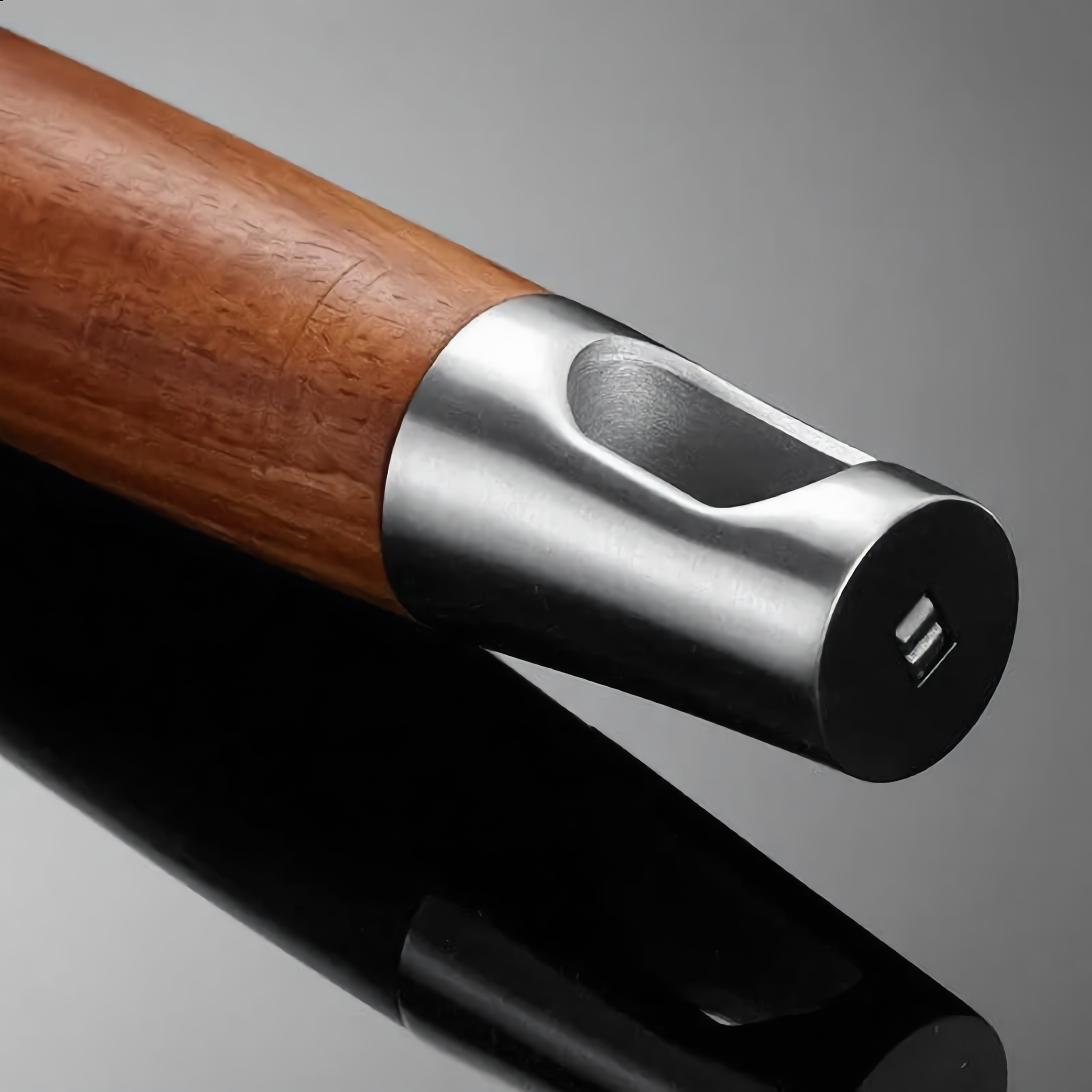 Close-up of the rosewood handle and steel cap with hanging hole