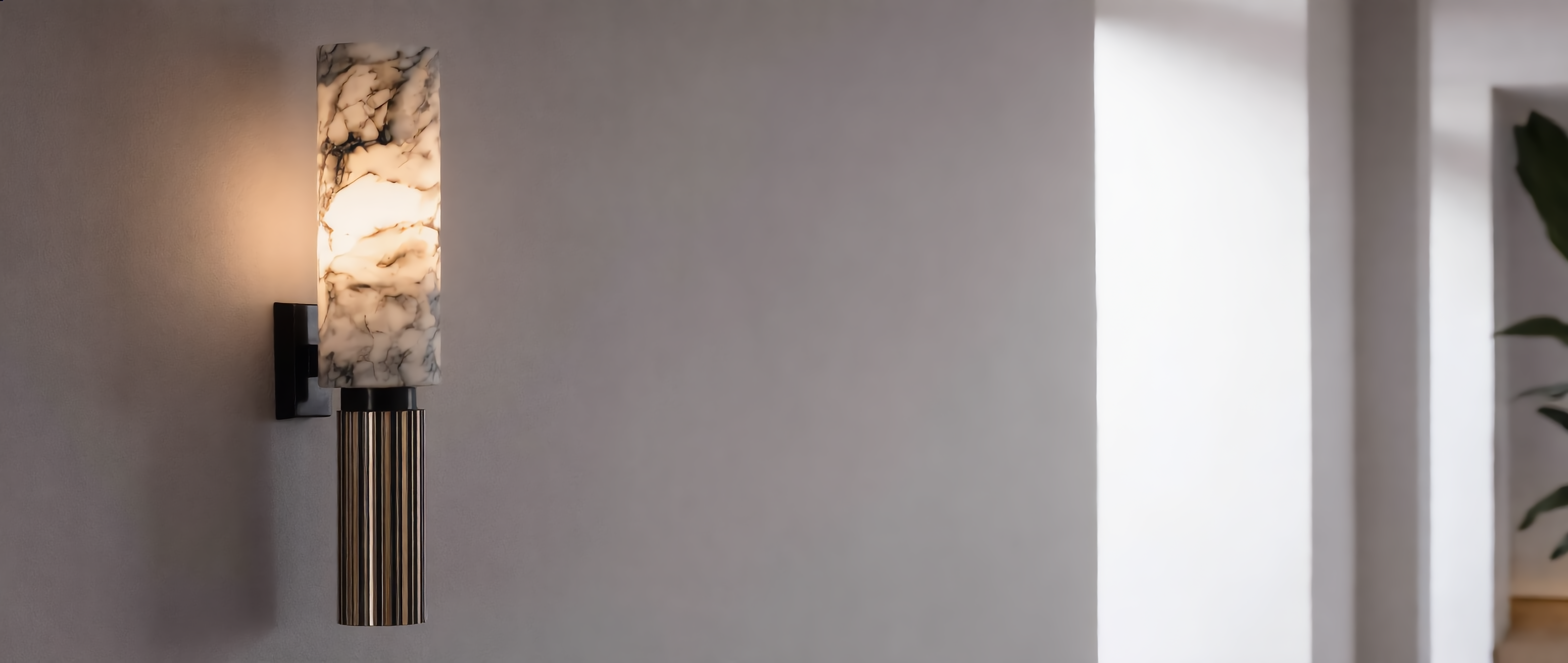 Aurora Marble Wall Sconce glowing on a living room wall