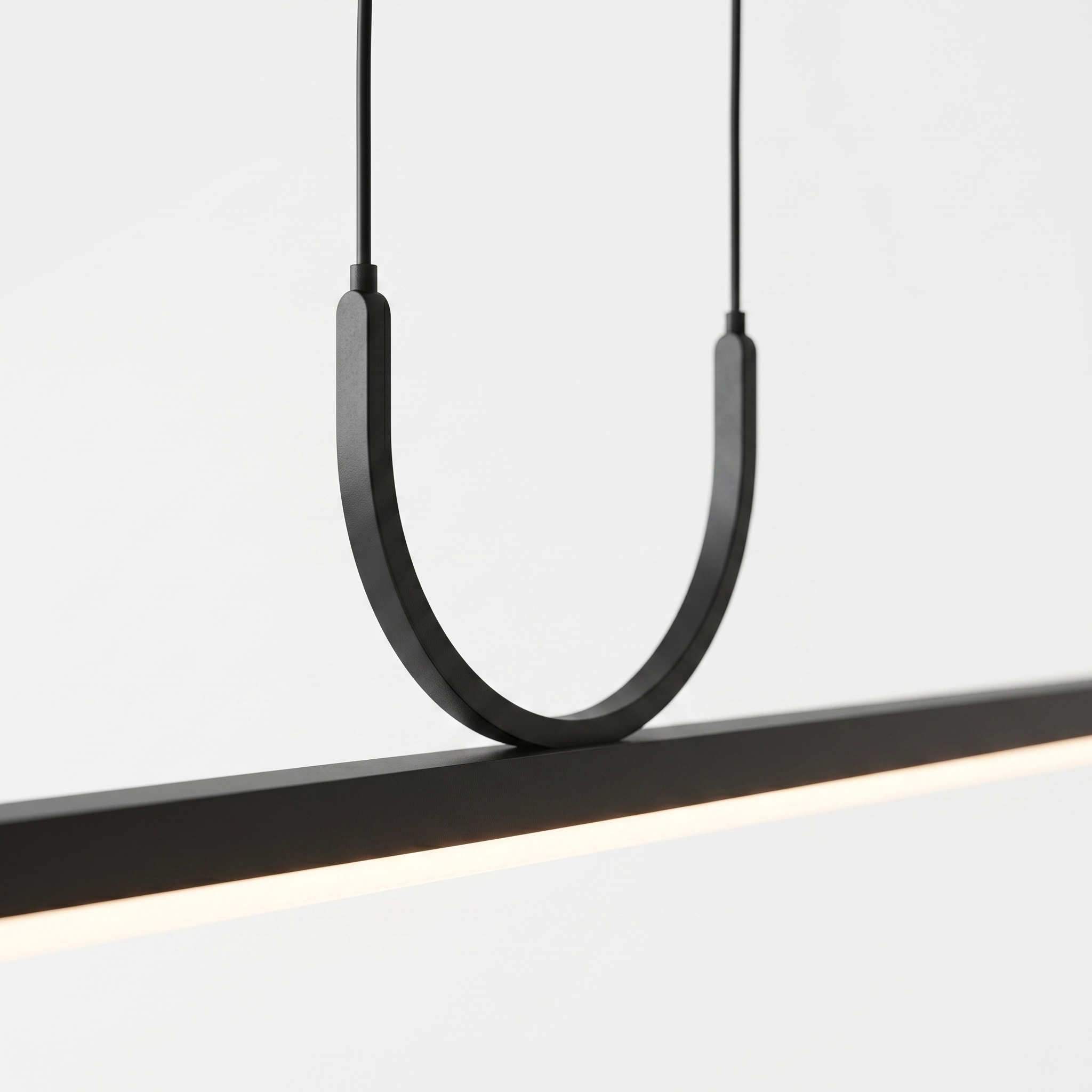 Close-up of the Orizzonte pendant signature U-loop suspension