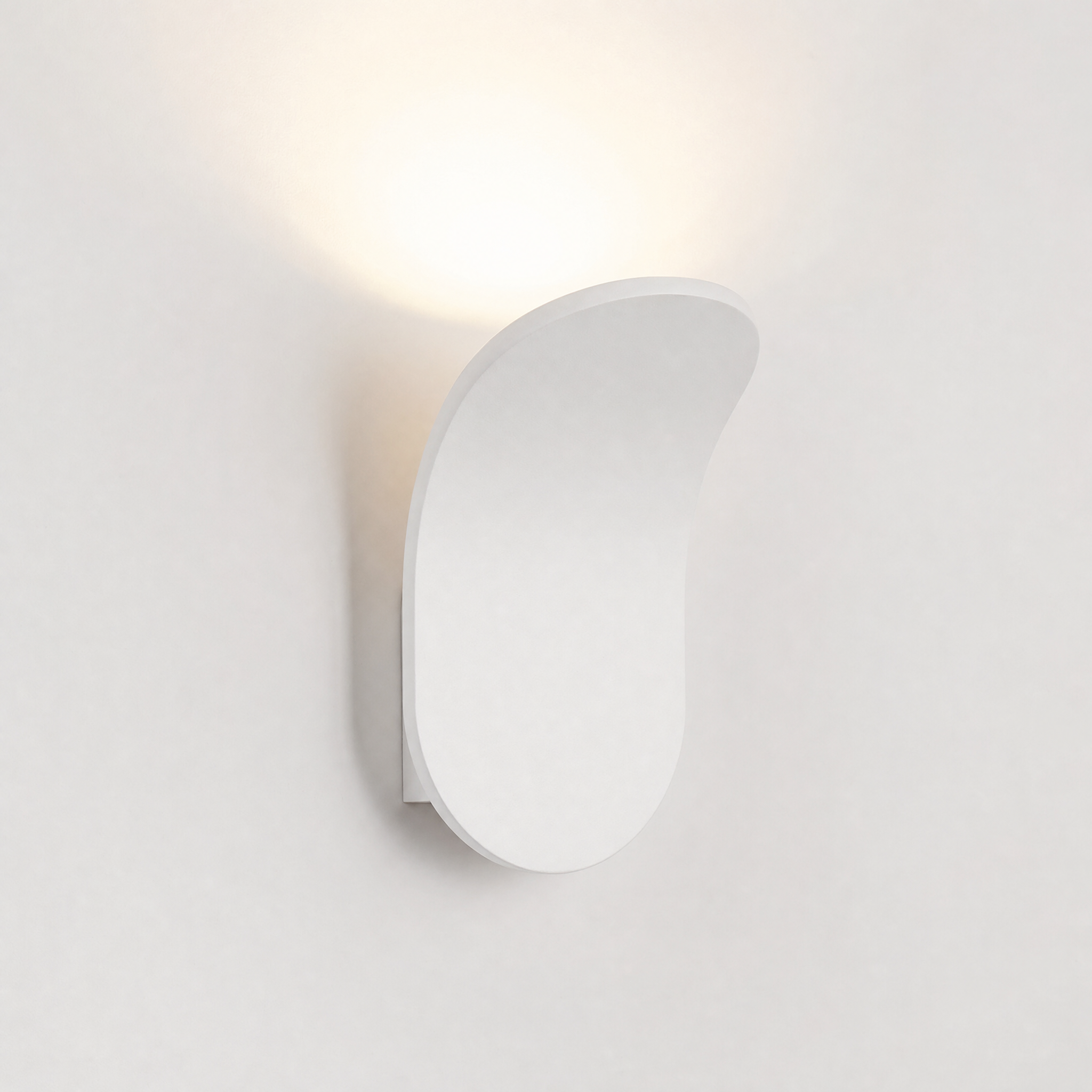 Matte white curved wall sconce neutral white glow