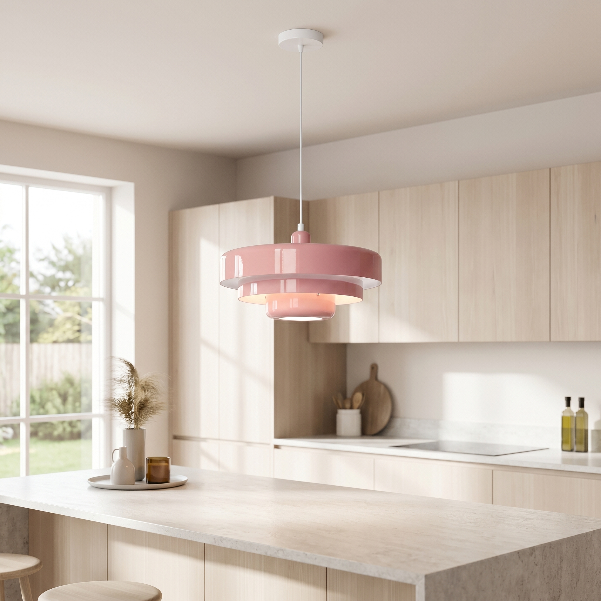 Pink macaron pendant light over a kitchen island