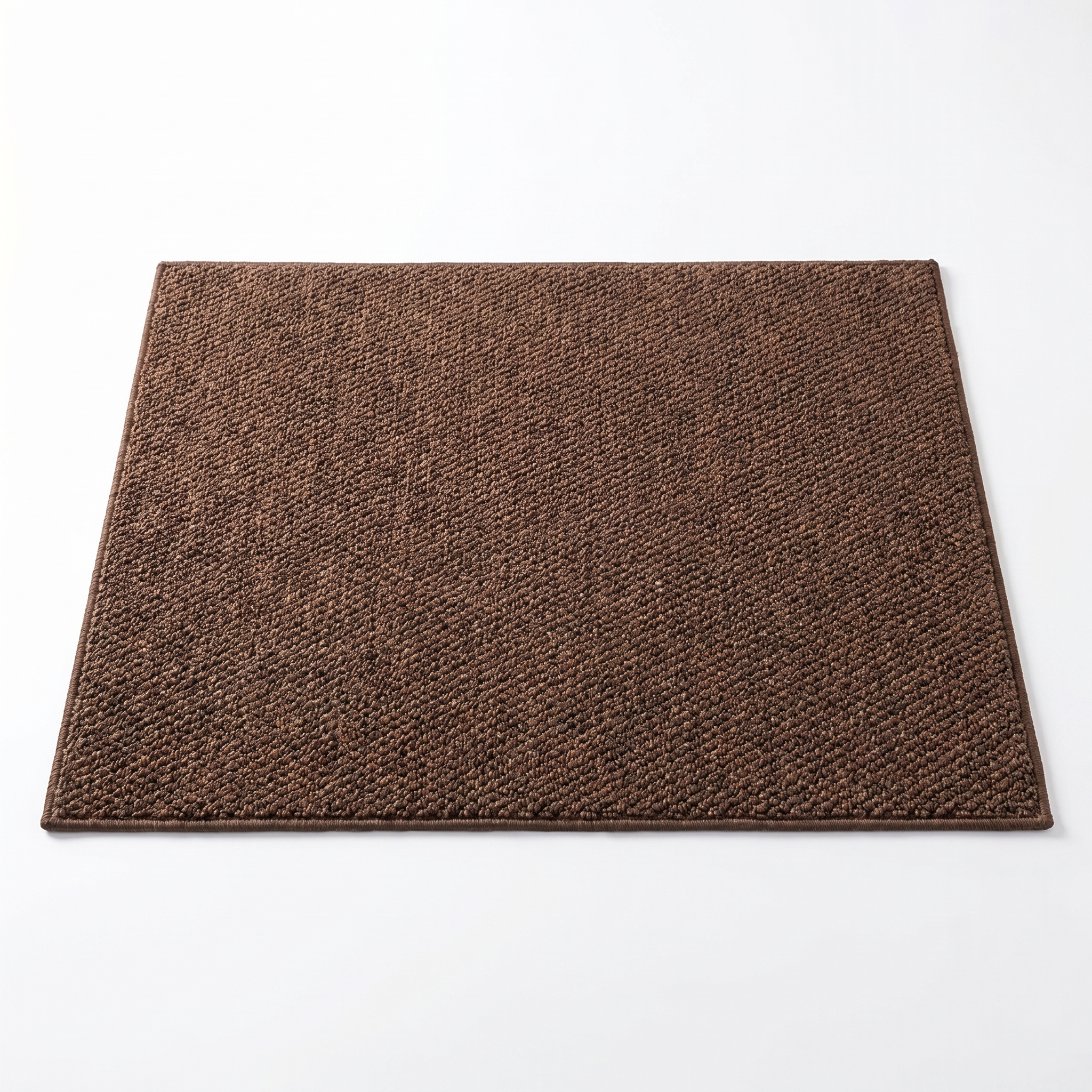 Trama absorbent woven bath mat in coffee, top-down on white