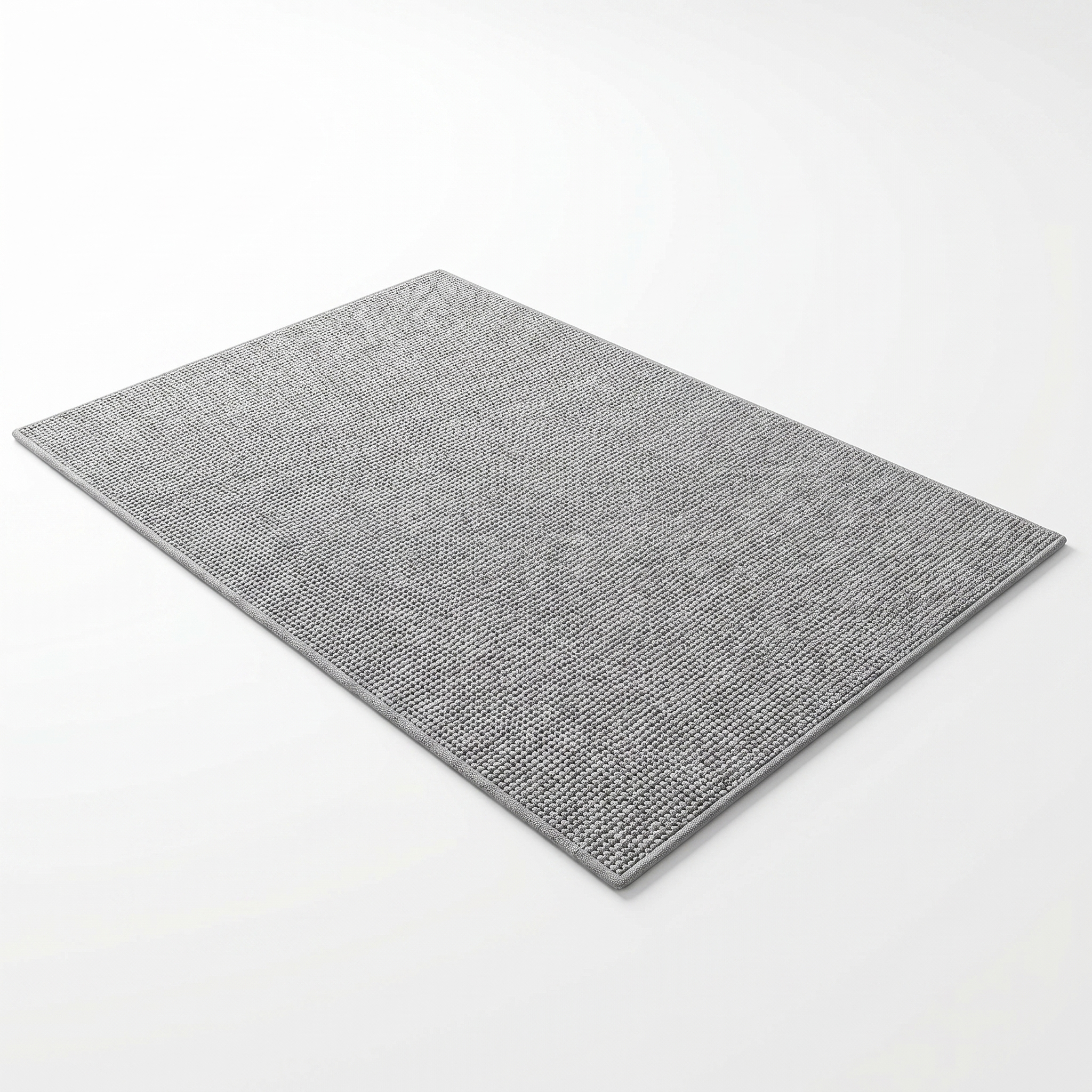 Trama absorbent woven bath mat in gray, top-down on white