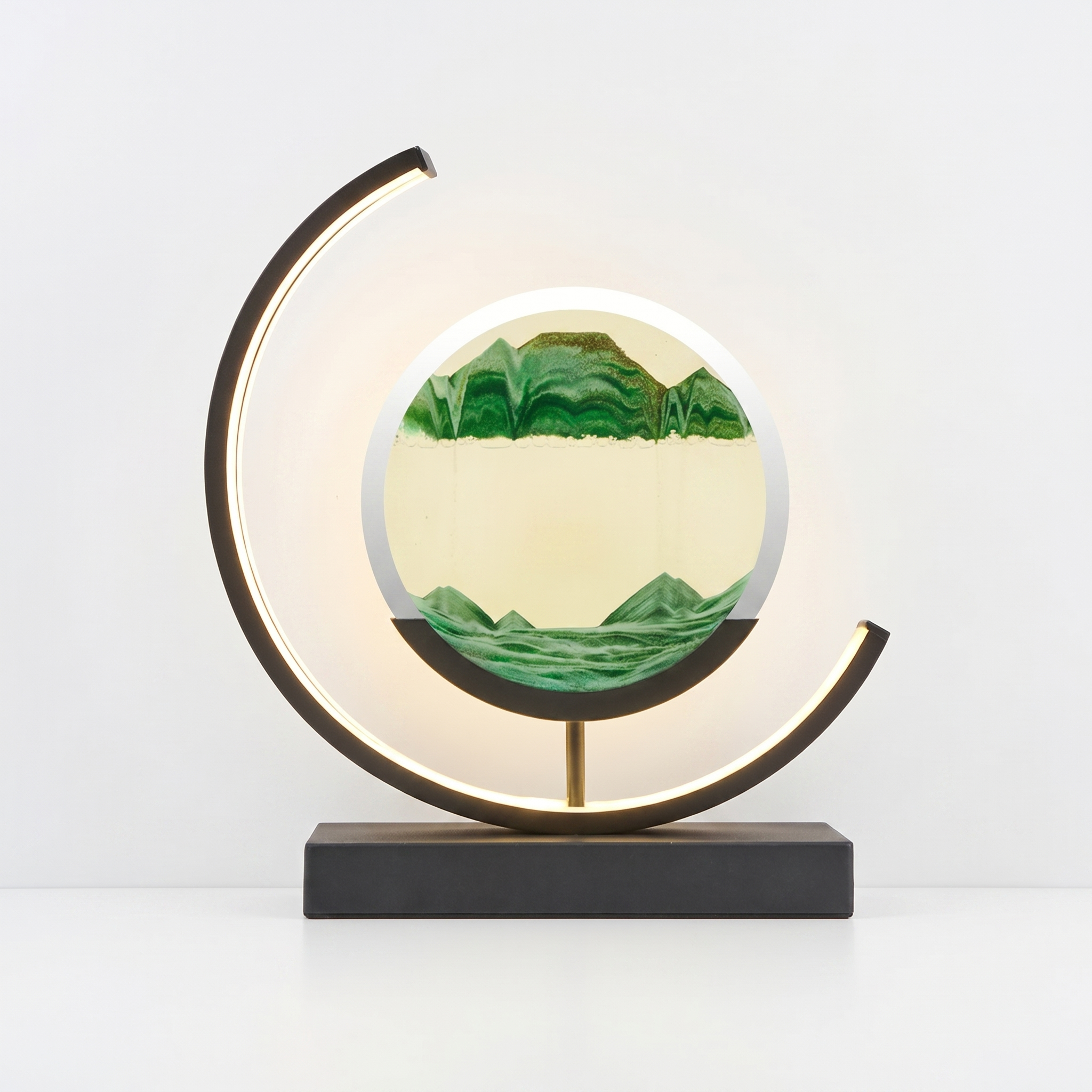 Duna moving sand art lamp with green sandscape, glowing, on white