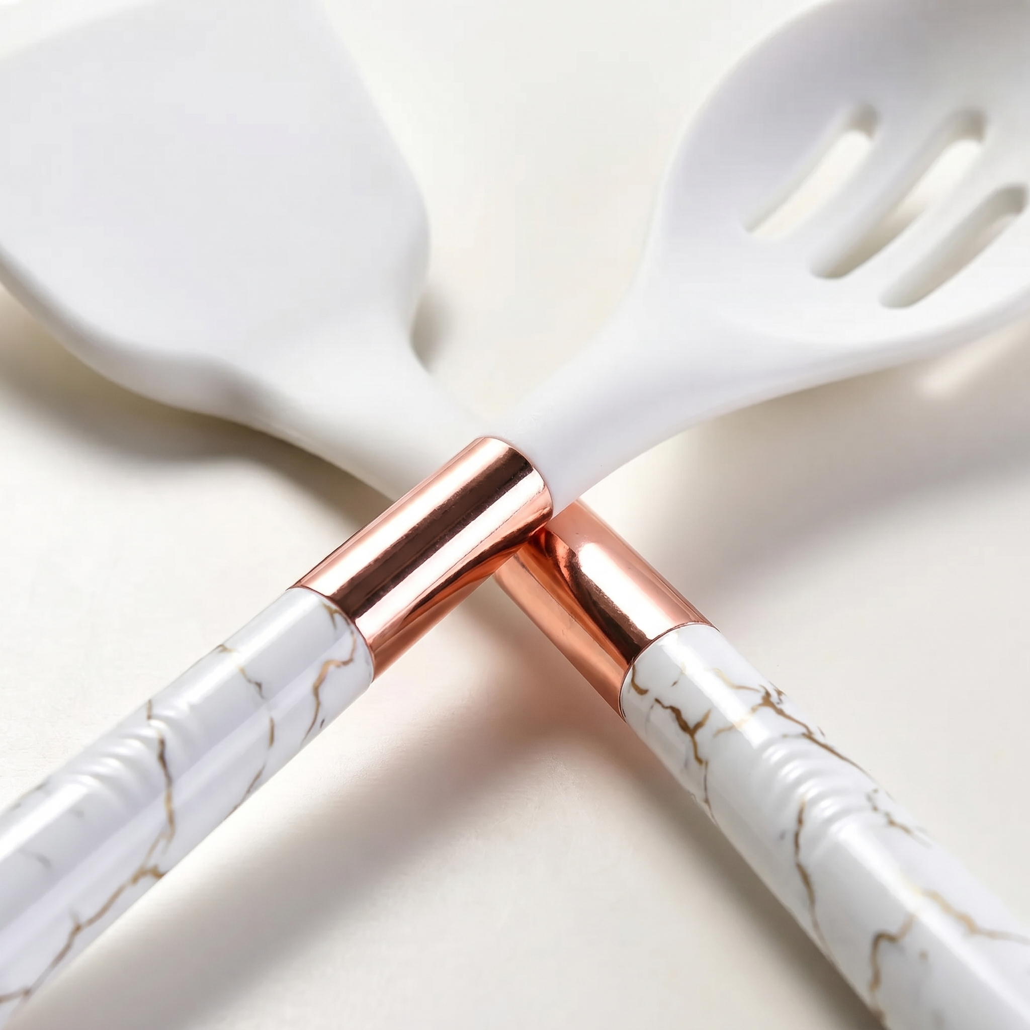 Macro detail of the Marmo rose gold band, marble handle and silicone head
