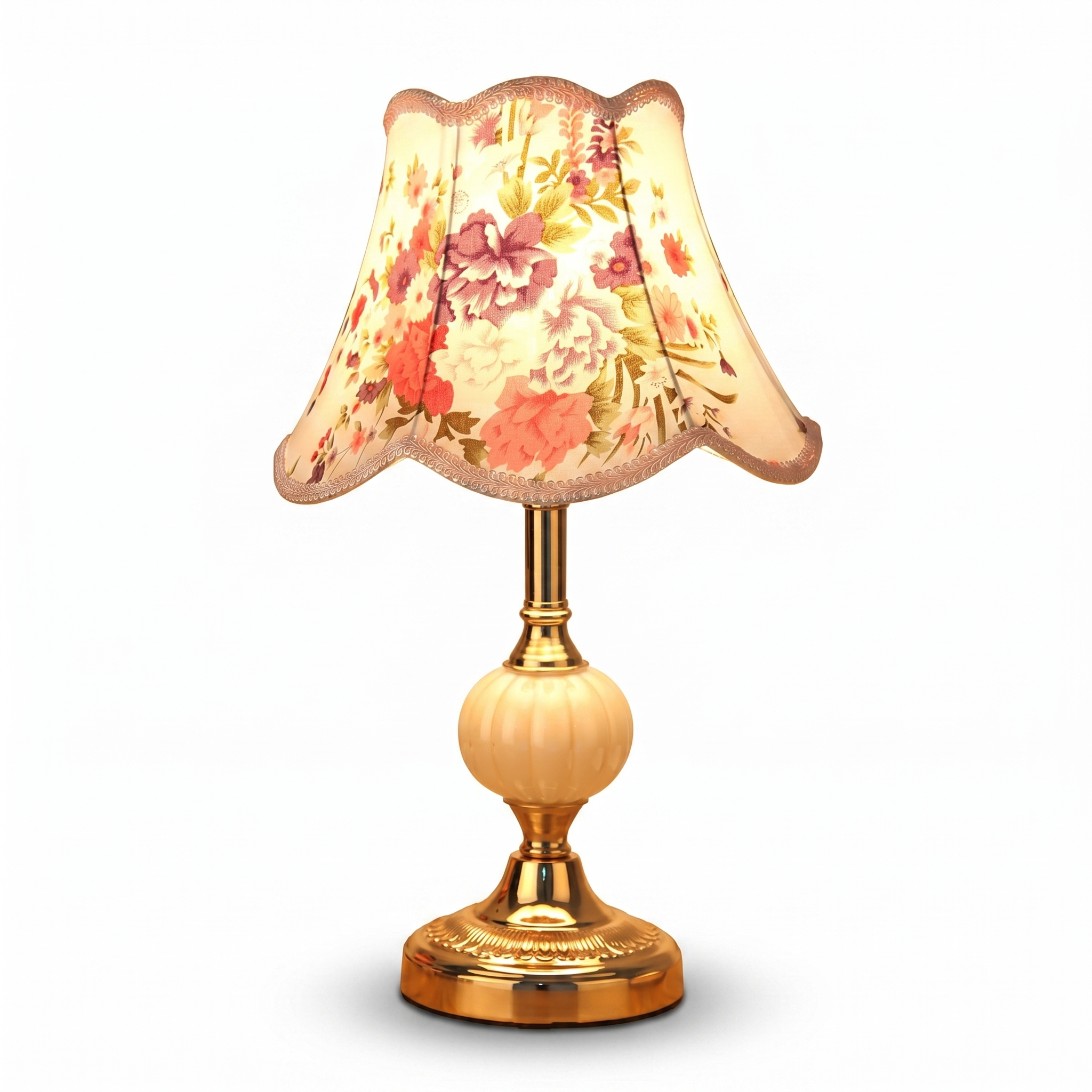 Vintage table lamp with gold base and peony floral shade on white background
