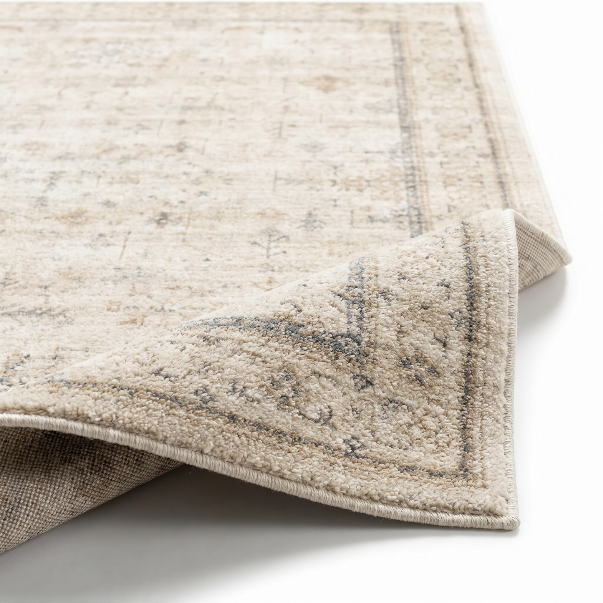 Vintage rug with folded corner showing plush pile and woven backing