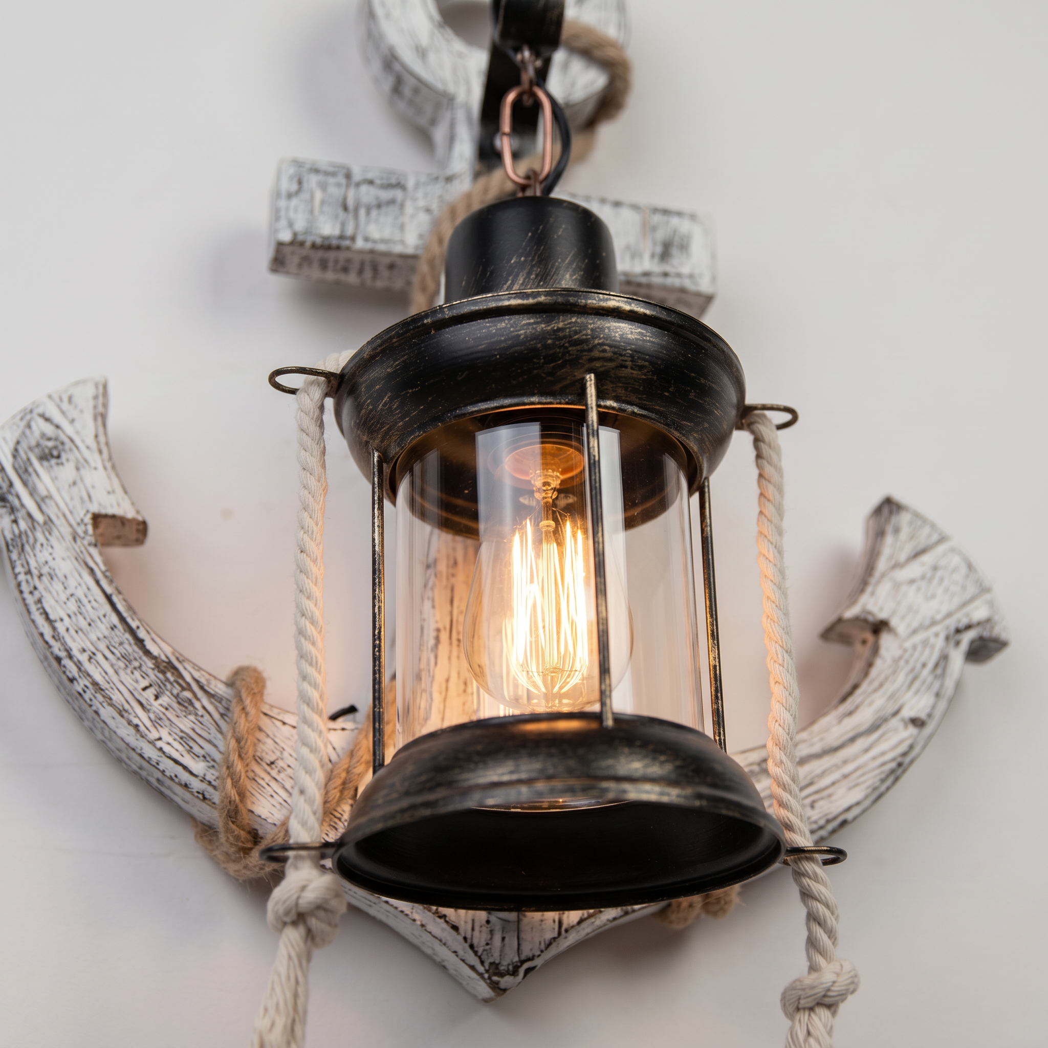 Close-up of the Faro sconce Edison bulb, lantern and rope detail