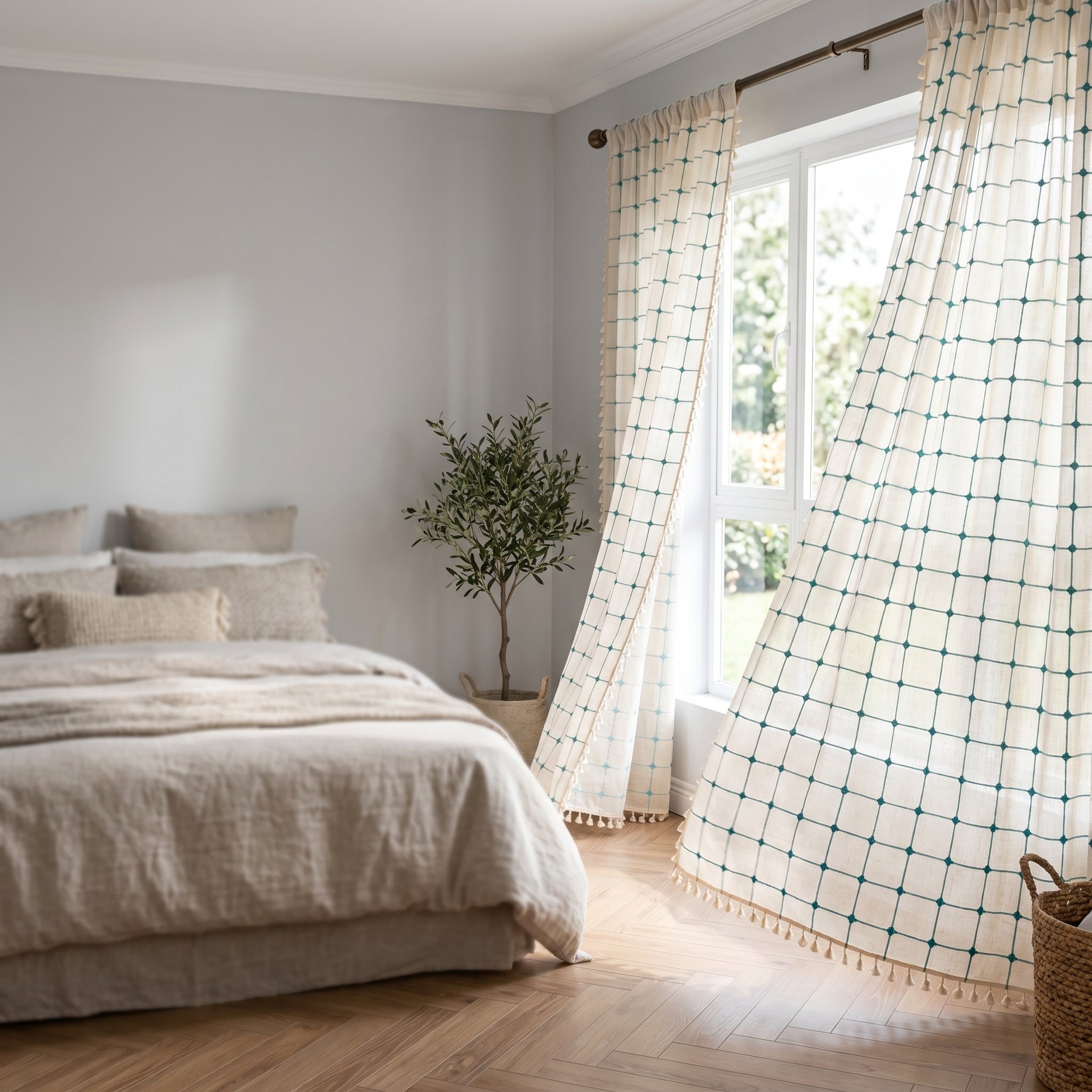 Laguna Geometric Tassel Curtains billowing at a bright bedroom window