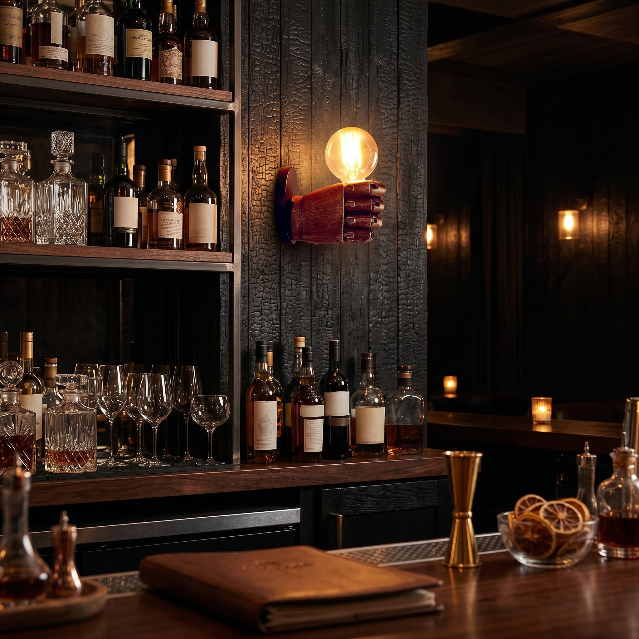 Mano fist wall sconce glowing in a cocktail bar