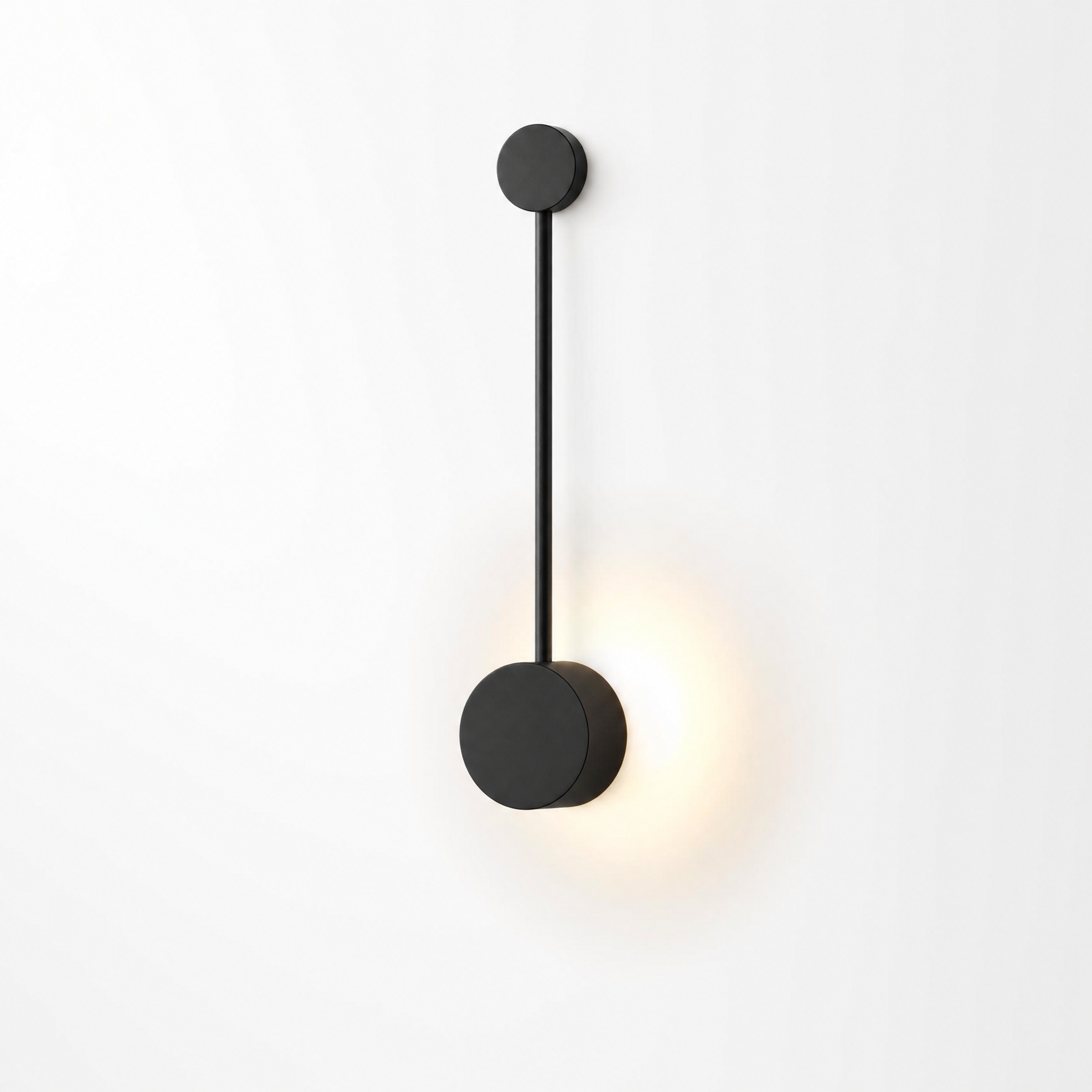 HERO Riflesso single-light wall lamp bouncing a round glow on a white wall
